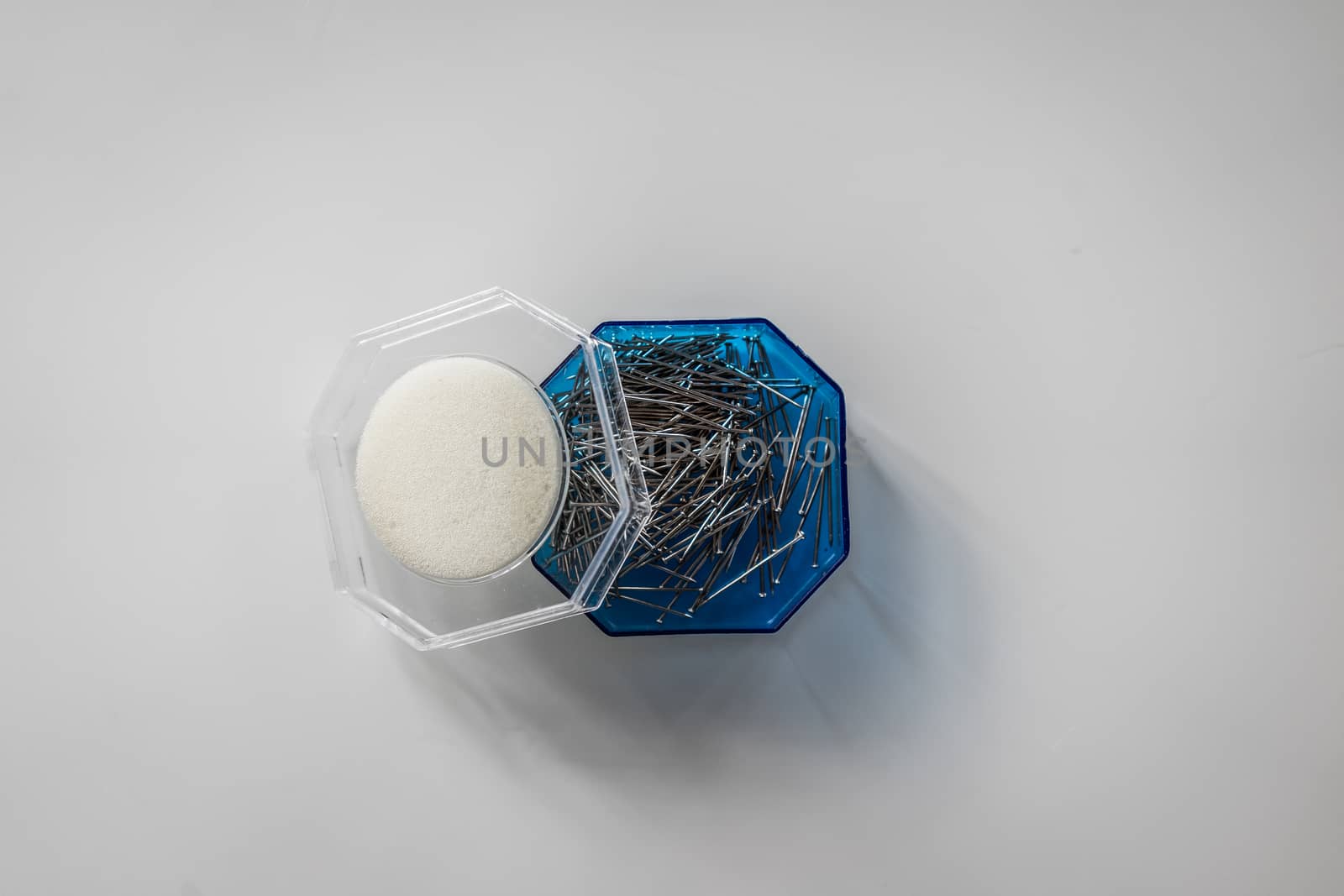 A top view shot of a box of needles.