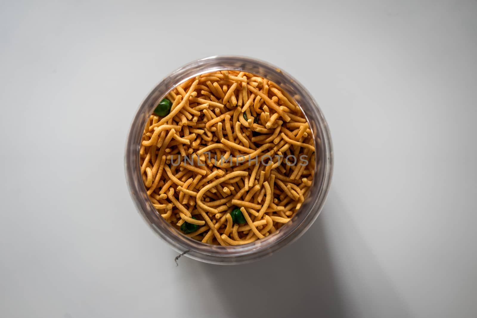 A top view shot of Malaysian traditional crispy snack in a glass container