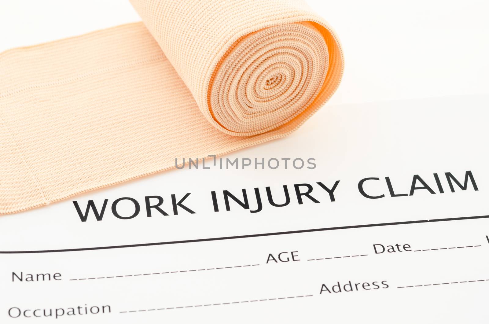 Claim form for an injury at work with medical bandage.