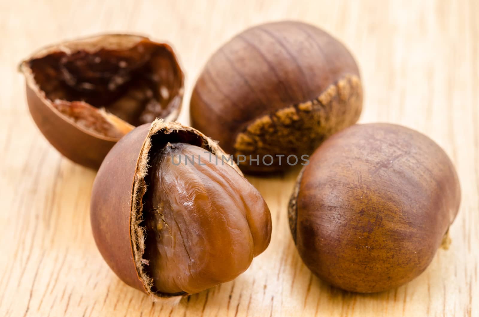 Japanese Chestnut , Castanea crenata on wooden background.