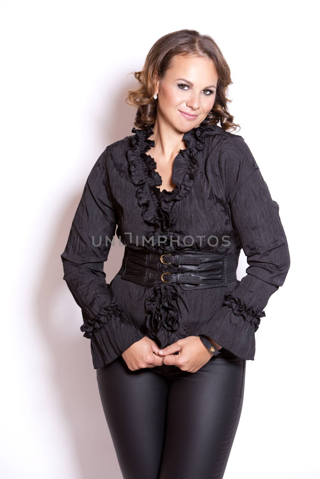 beautiful woman wearing black upscale outfit on white background