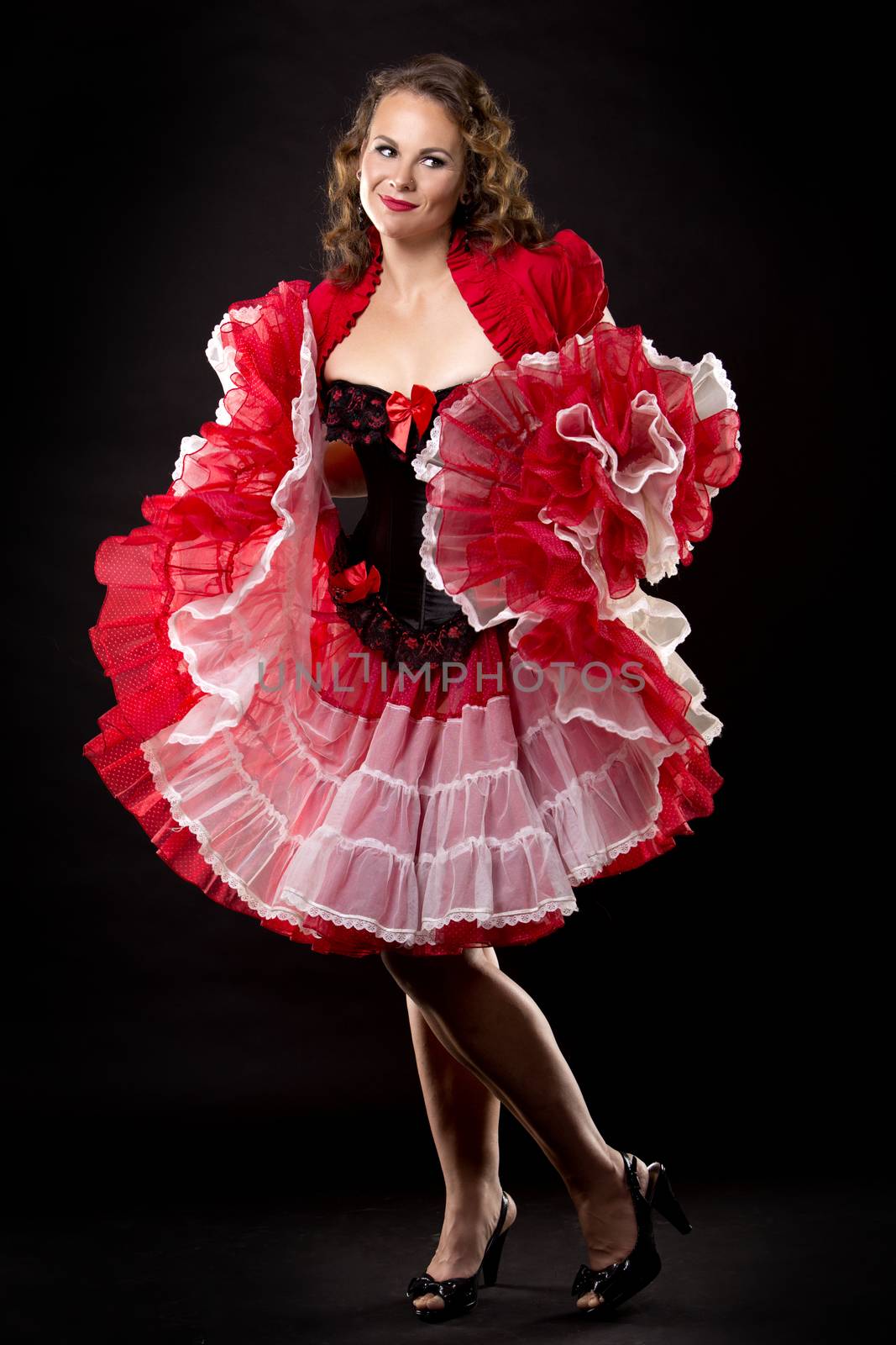 beautiful woman wearing red and black pinup outfit 