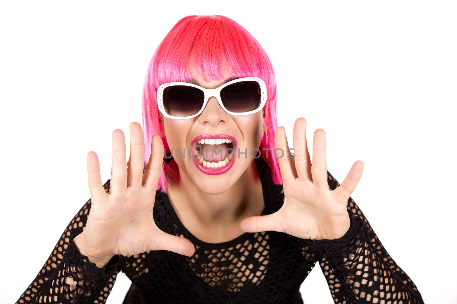 woman with pink hair wearing colorful stylish outfit