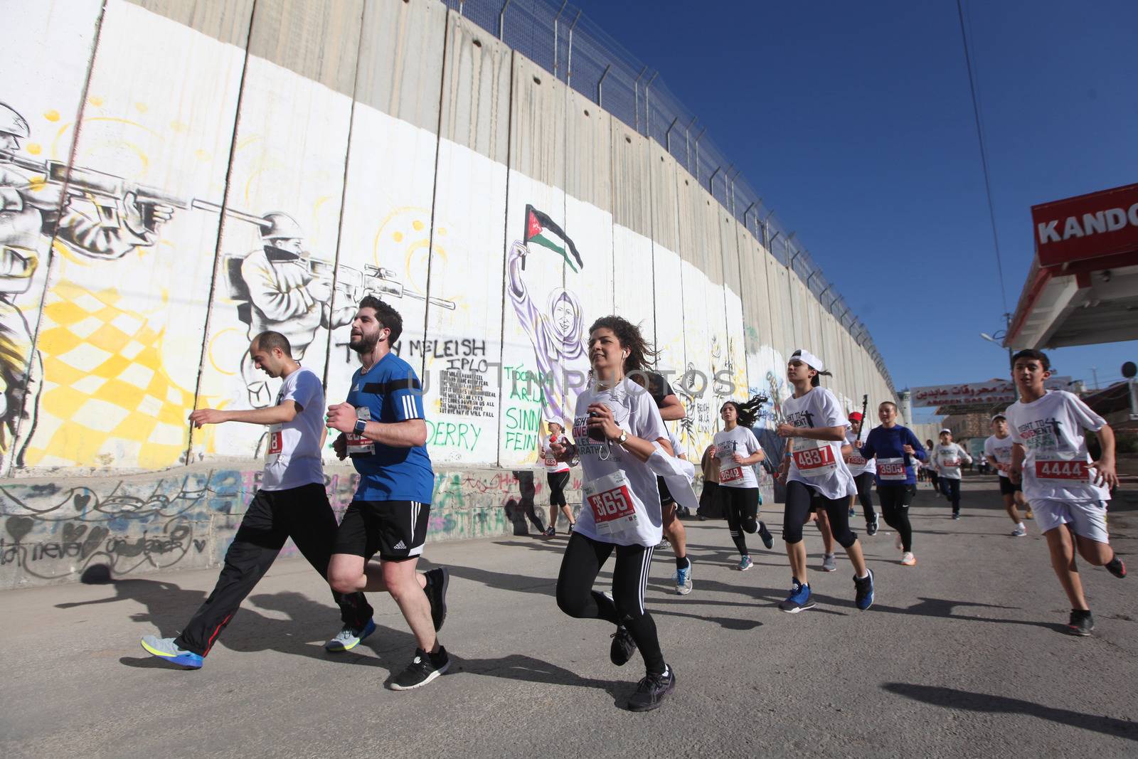 WEST BANK, Bethlehem: Participants ran past parts of Israel's separation barrier near the biblical West Bank town of Bethlehem during the 4th annual Palestine Marathon on April 1, 2016. Runners from 64 countries ran through Bethlehem under the banner of the right to freedom of movement. Organizers said that more than 4,000 people registered for the event.