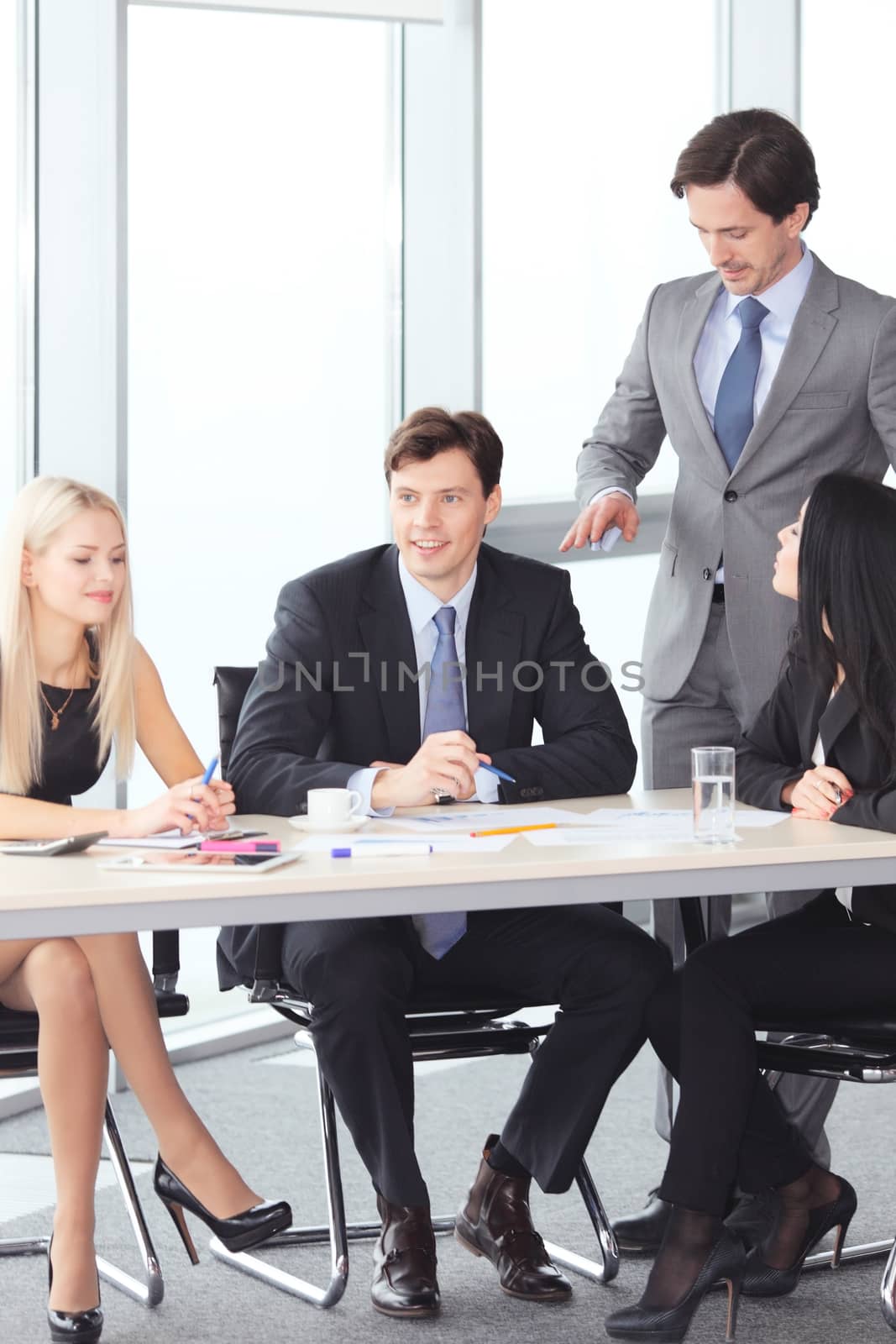 Business people discussing financial reports in office