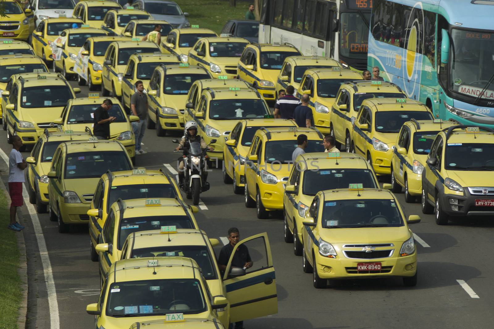 BRAZIL, Rio de Janeiro: Taxis block the street in Rio de Janeiro, Brazil on April 1, 2016. Taxi drivers are outraged that Uber, which does not have the authorization to operate in Rio, continues to do so under a court injunction. The demonstrators called for Uber to leave Brazil.