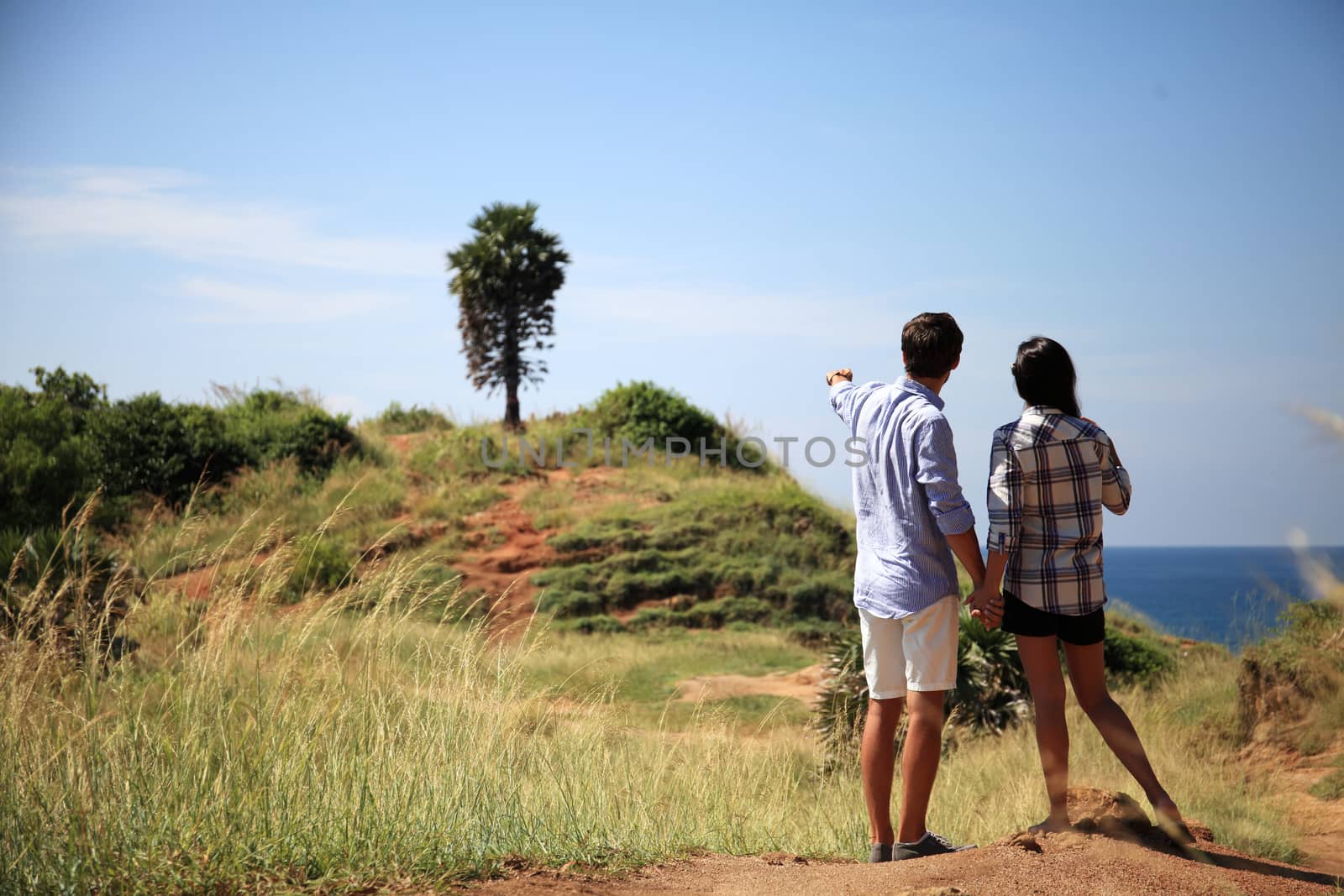 Young couple enjoy beautiful sea view on vacation