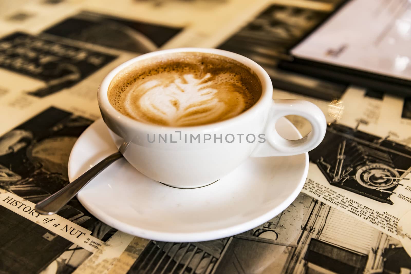 Loving coffee. Cup of fresh cappuccino  with flower sign