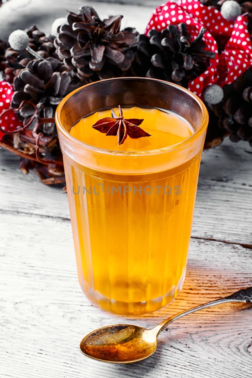 pumpkin jelly drink with anise in the background with wreath of fir cones in autumn