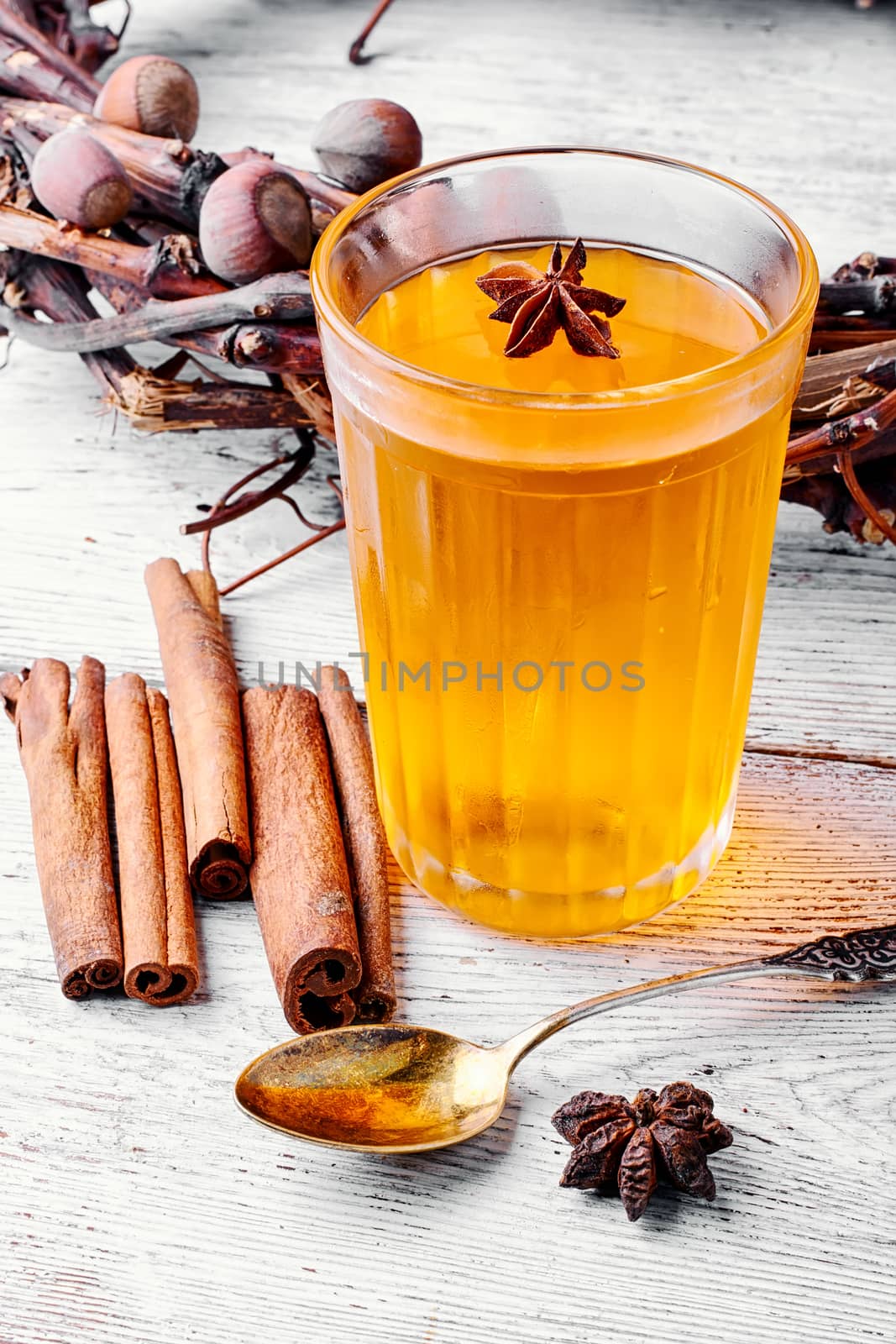 pumpkin jelly drink with anise in the background with wreath of fir cones in autumn