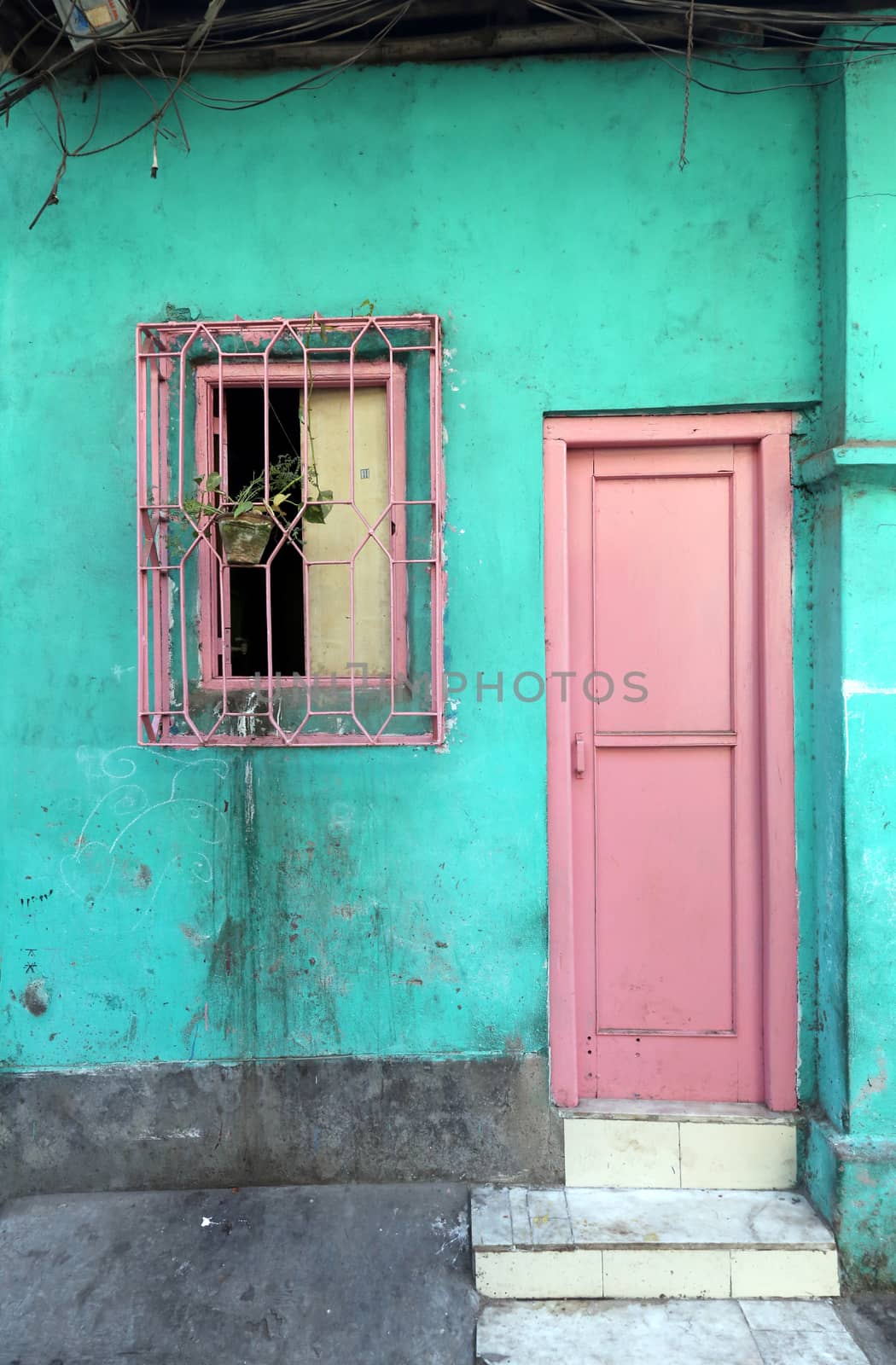Colorful Indian house. Bright green building in Kolkata, West Bengal, India