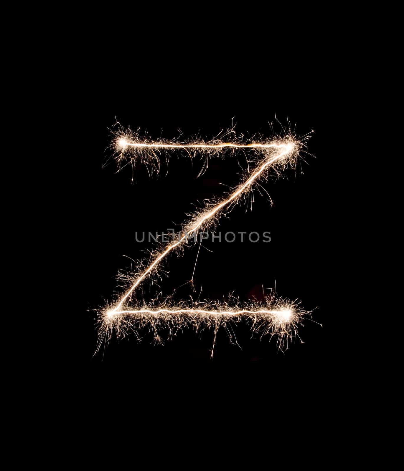 Letter Z drew with spakrs on a black background.