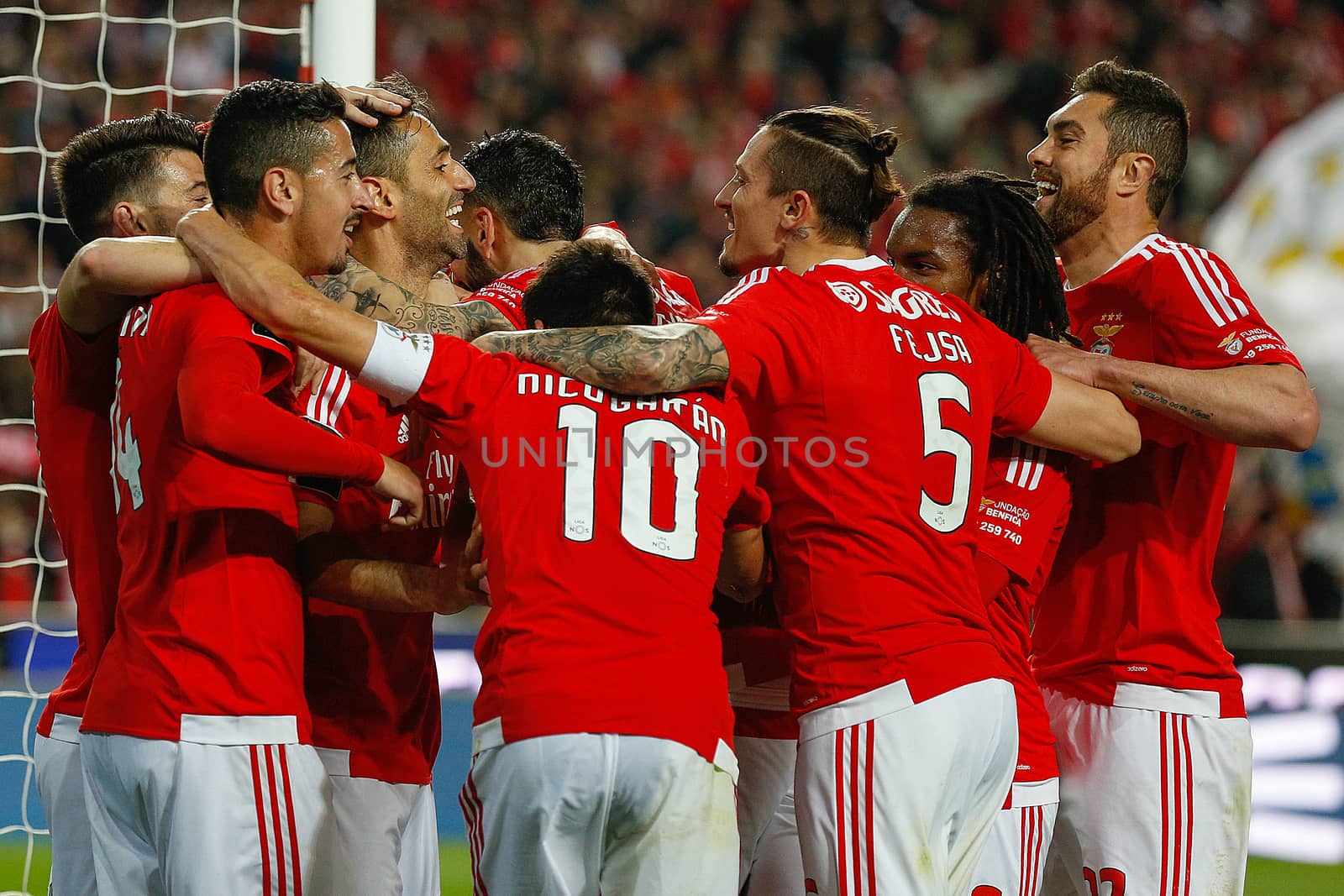 PORTUGAL, Lisbon: Benfica's players celebrate a goal during the Portuguese Liga football match between Benfica and SC Braga (5-1) at Luz Stadium, in Lisbon, on April 1, 2016.