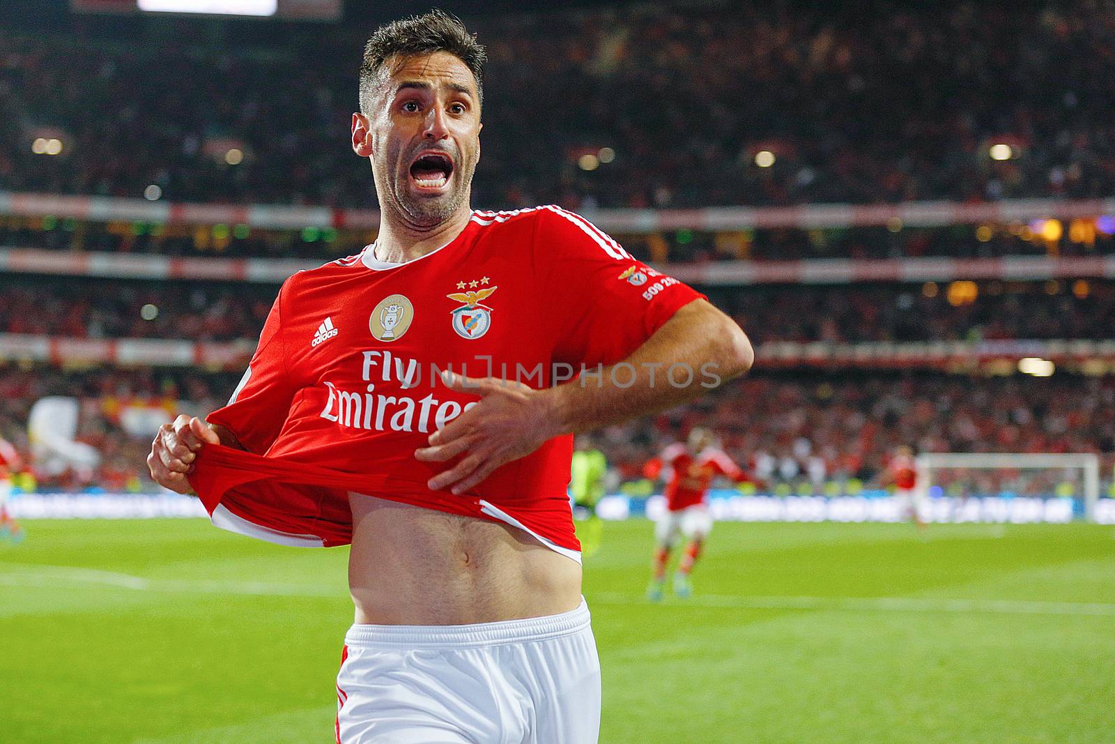 PORTUGAL, Lisbon: Benfica's forward Jonas Gonçalves Oliveira, known as Jonas (C), celebrates a goal during the Portuguese Liga football match between Benfica and SC Braga (5-1) at Luz Stadium, in Lisbon, on April 1, 2016.