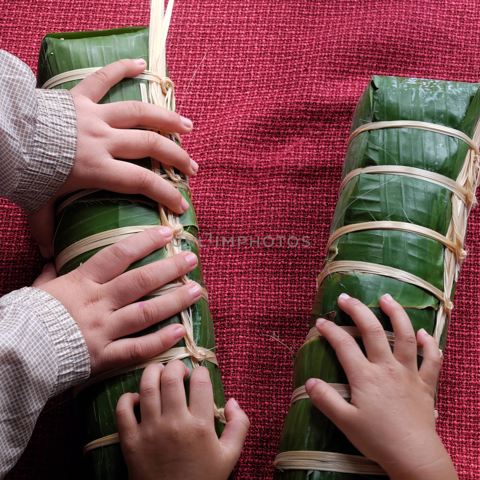 Vietnamese food, traditional food on tet holiday in spring, banh tet also name Cylindric glutinous rice cake, make from sticky rice, mung been, cover by banana leaf, tradition eating on lunar new year