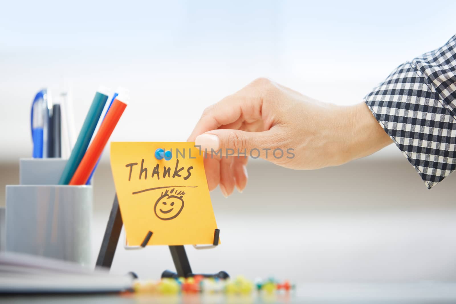 Thanks text on adhesive note by Novic