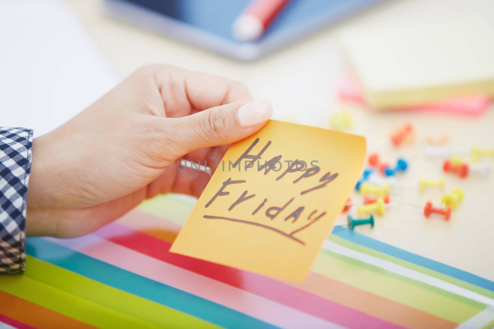 Happy Friday text on adhesive note by Novic