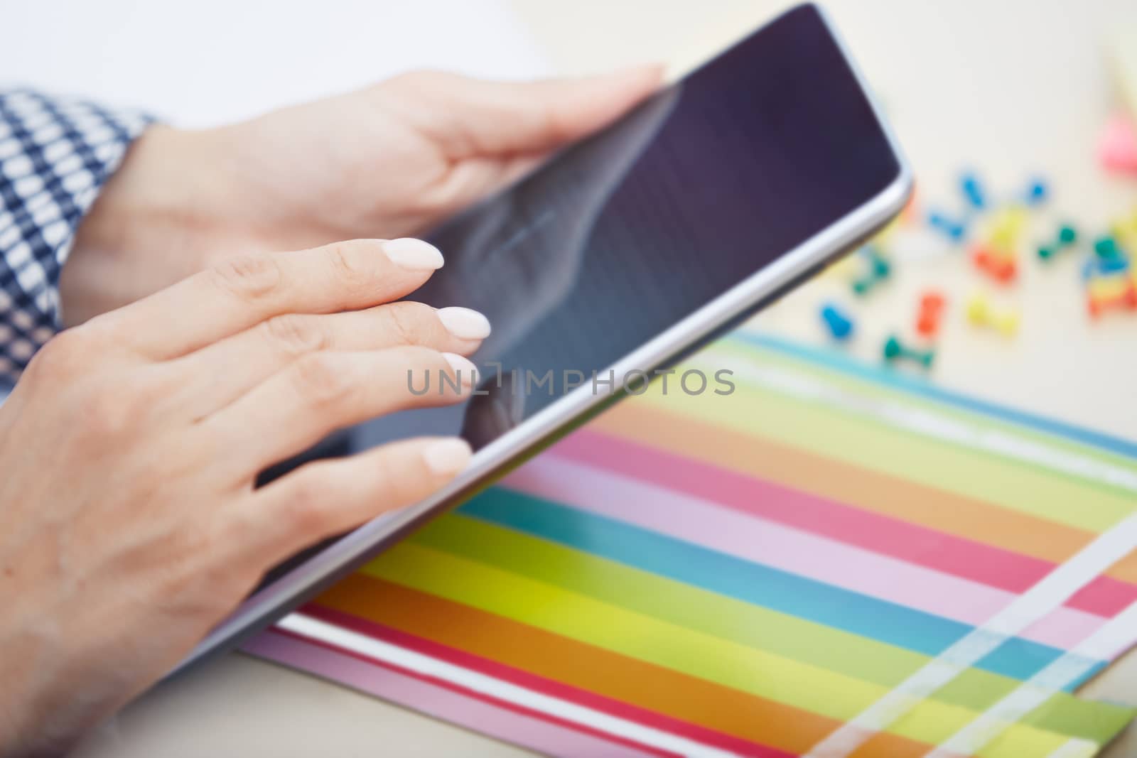 Hands of businessperson using digital tablet