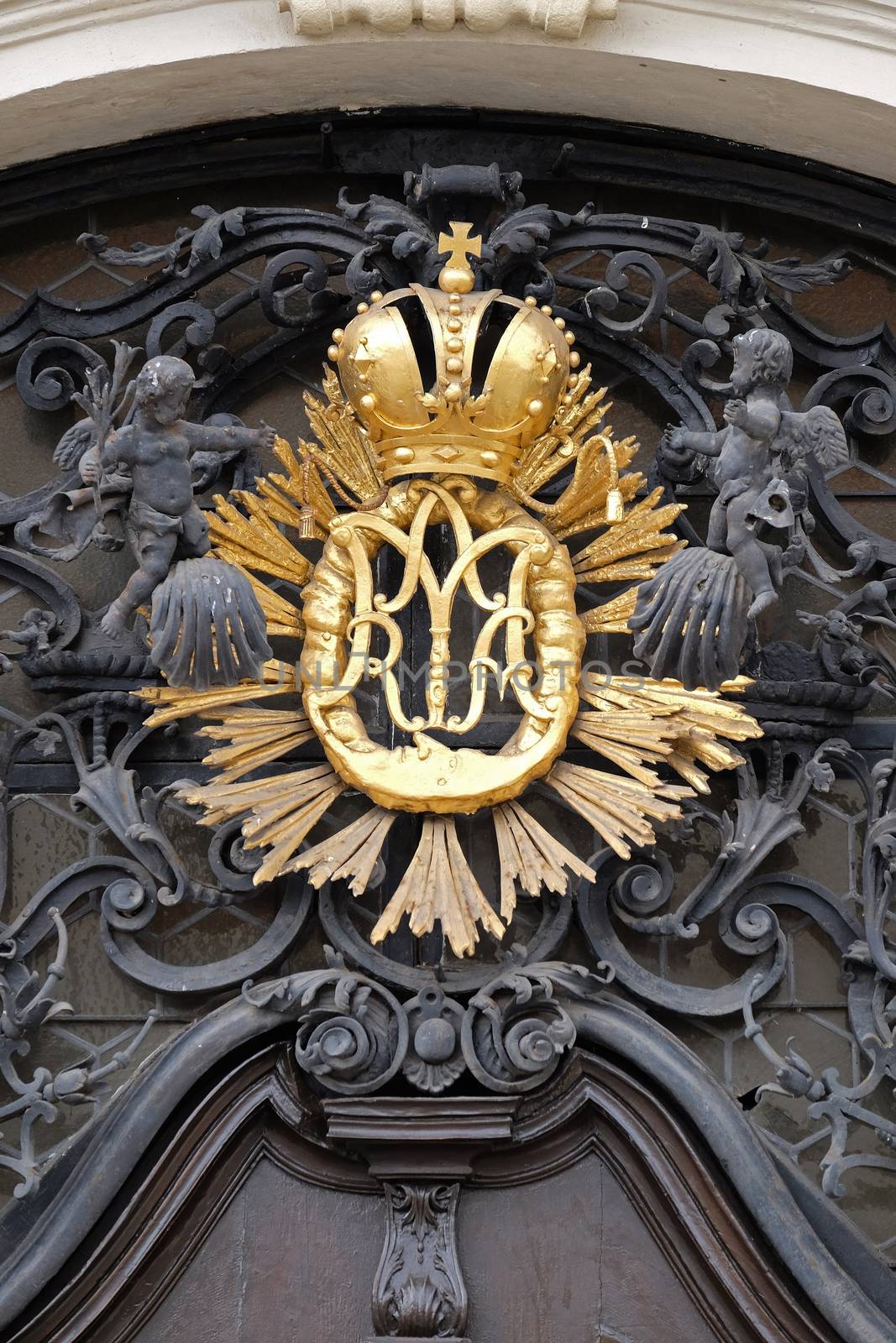 Our Lady monogram on the main entrance, Mariahilf church in Graz, Styria, Austria