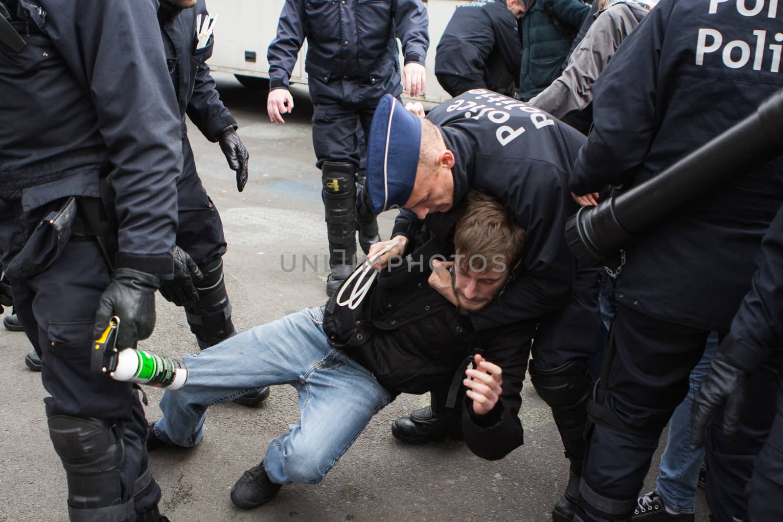 BELGIUM, Brussels: Police arrest at least ten people during a demonstration against racism at Bourse square on April 2, 2016, central Brussels, according to Belgian newspaper Le Soir. Belgian authorities ban any gathering on the same day. A week before, riot police fired water cannon at far-right football hooligans who invaded the same square in the Belgian capital that has become a memorial to the victims of the Brussels attacks. 
