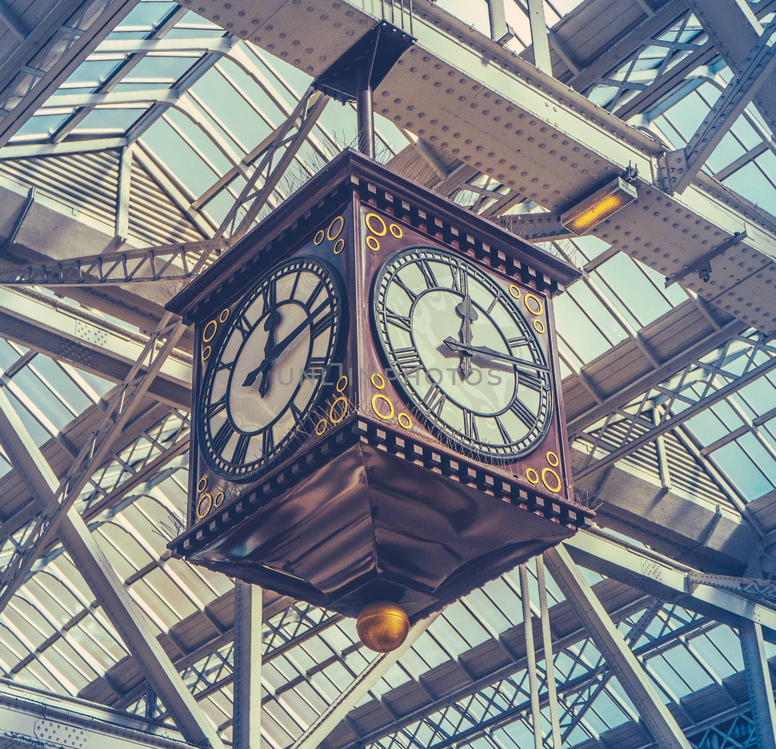 Retro Image Of The Vintage Clock And Meeting Point Under The Glass Roof Of Glasgow Central Station