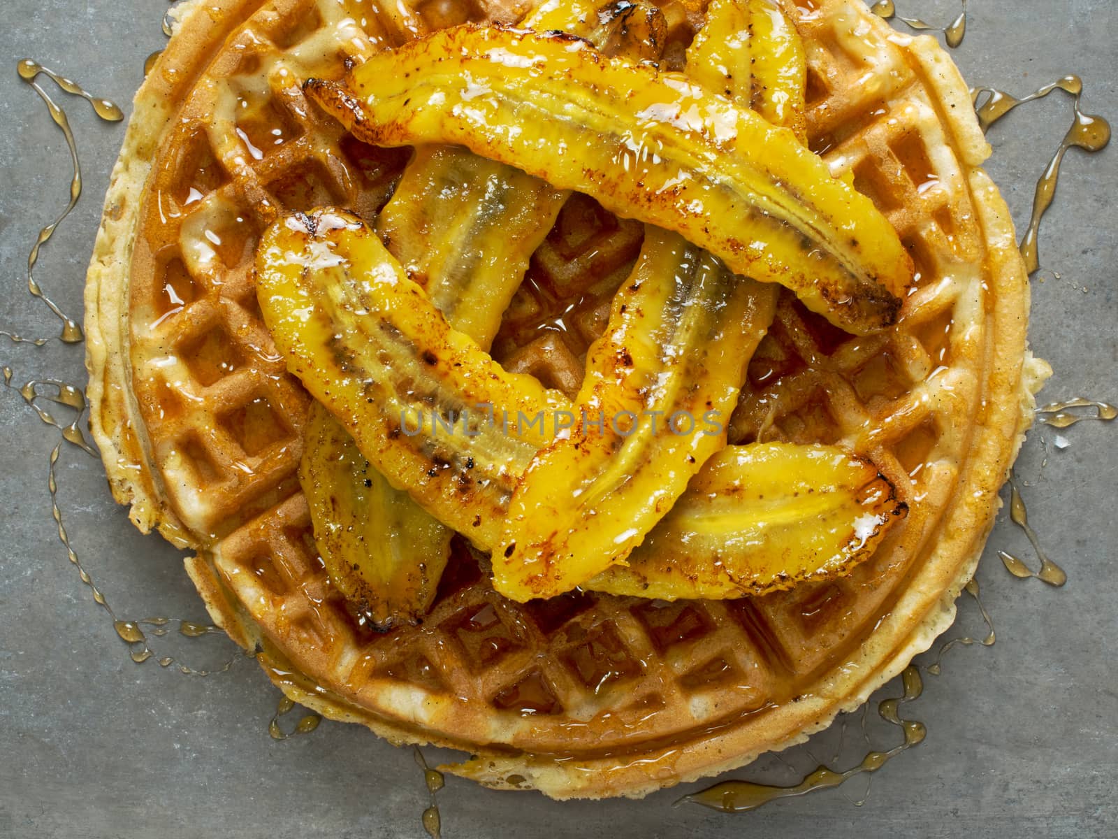 rustic sweet banana waffle with syrup by zkruger