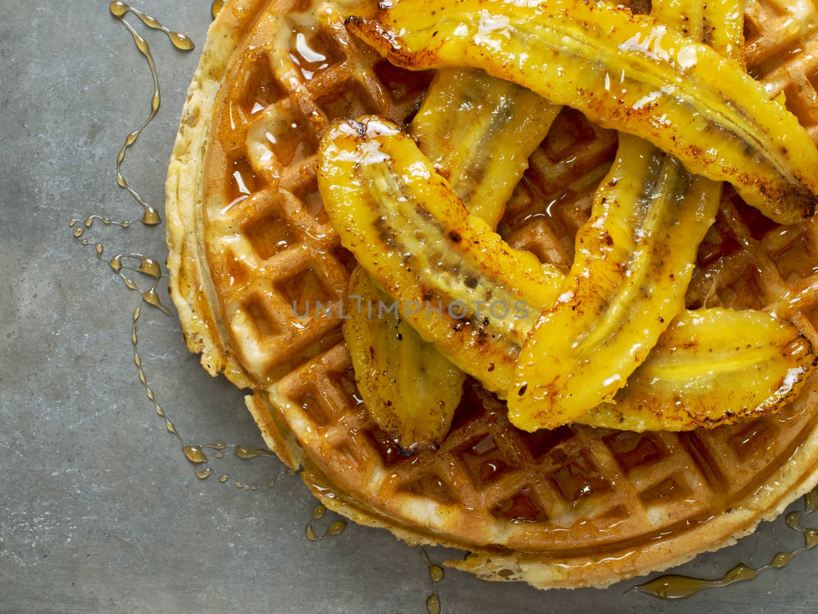 close up of rustic sweet banana waffle with syrup