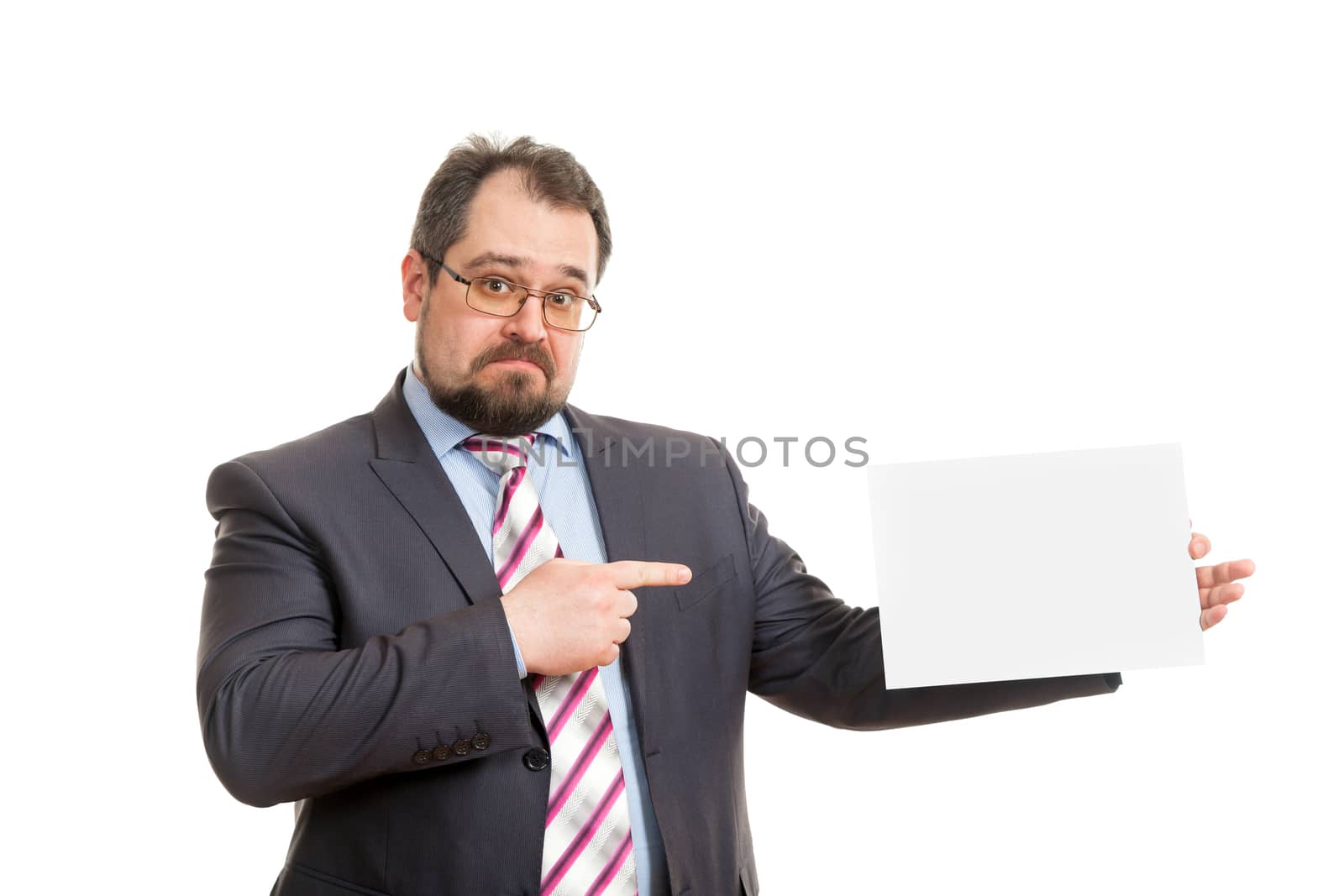 the adult man holds a sheet of paper in hand
