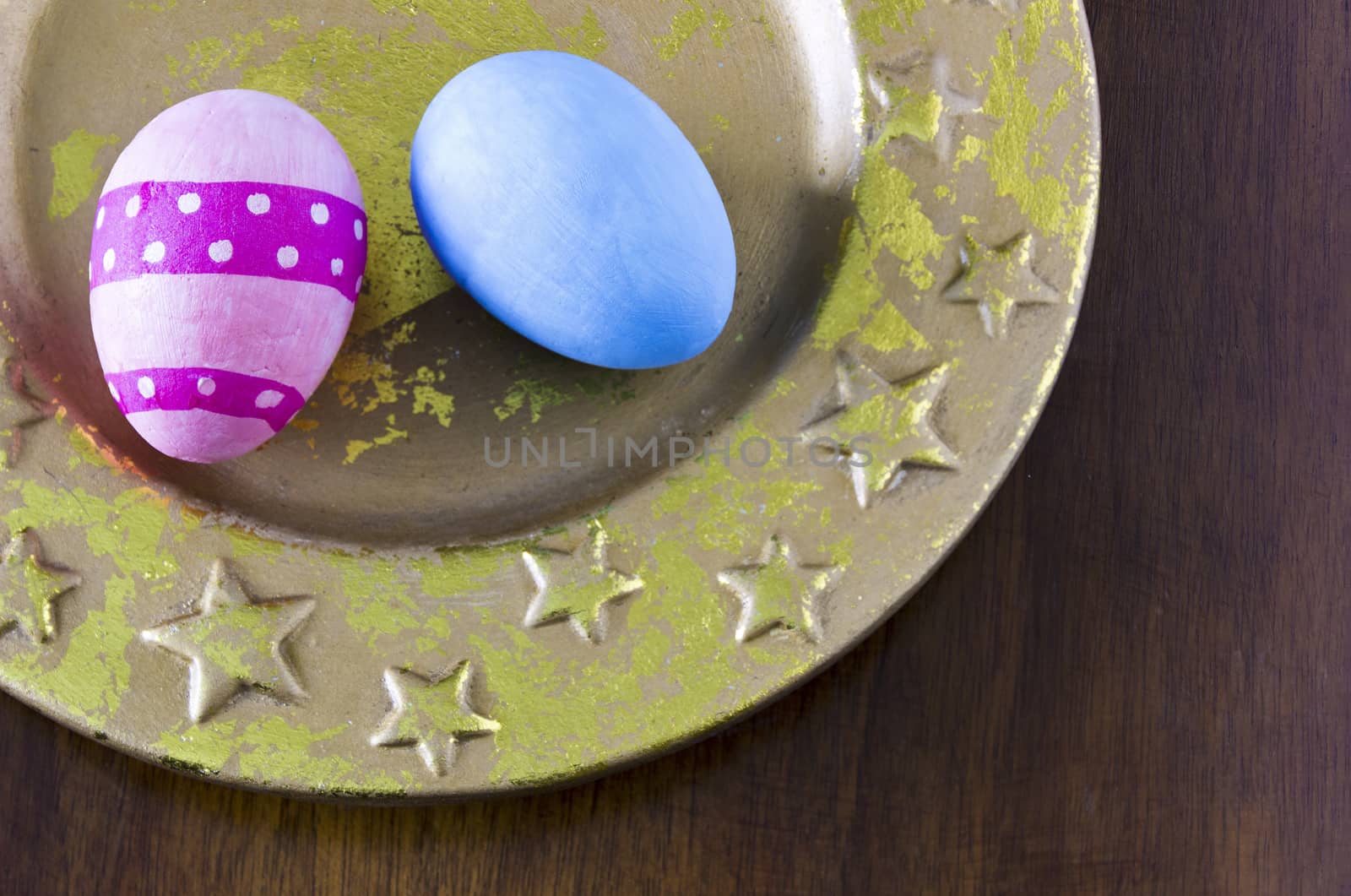 Colorful Easter eggs decorated on the holiday platter