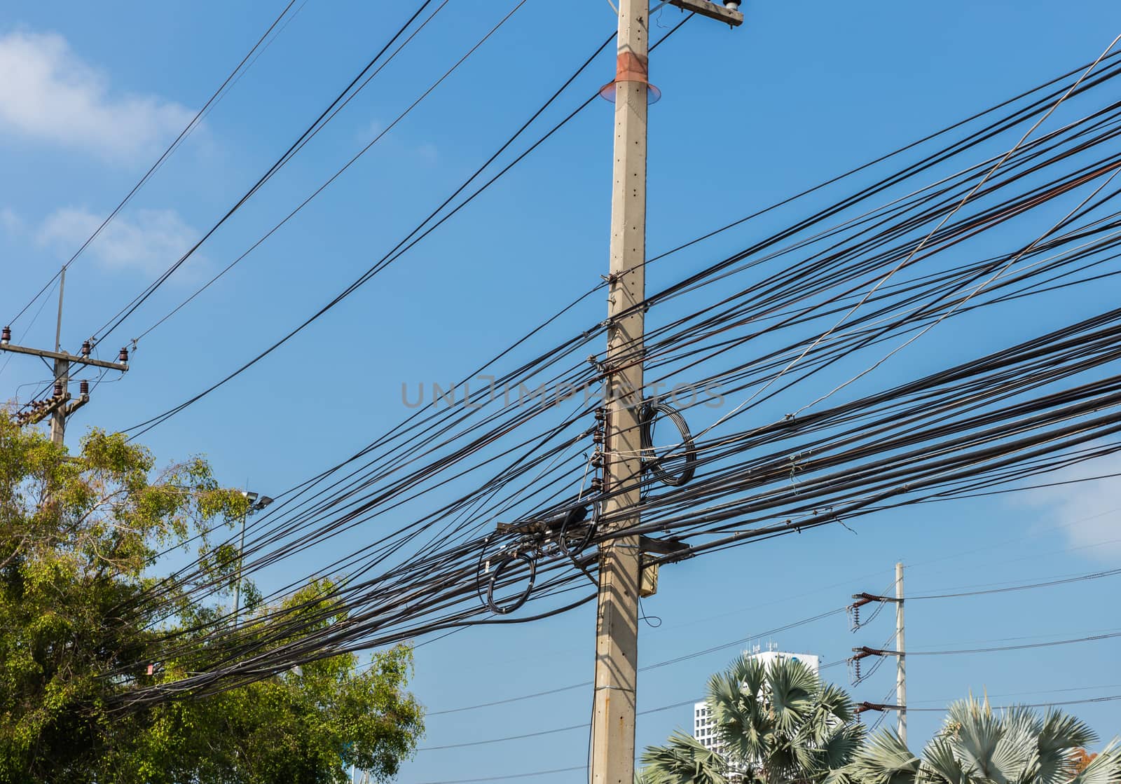 Electric pole power lines with blue sky,Thailand