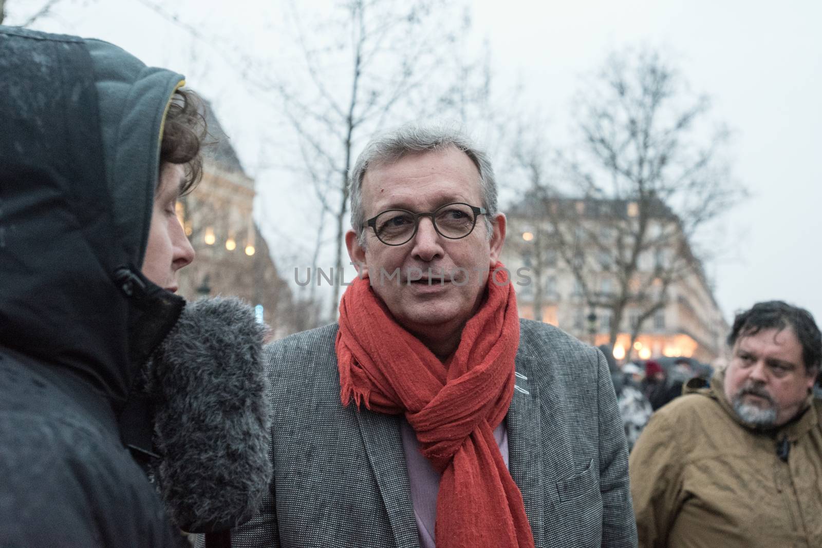 FRANCE, Paris : French Communist Party (PCF) General Secretary and Party of the European Left (EL) president Pierre Laurent (R) speaks to French Europe Ecologie Les Verts (EELV) green party spokesman Julien Bayou (L) as people join the Nuit Debout or Standing night movement at the Place de la Republique in Paris on April 2, 2016. A few hundred people rallied to demand the halt of home evictions which can begin the day after the end of the French winter break, after which tenants can be evicted from their homes. They also gathered to show their opposition to the labor reform law in the wake of the nationwide demonstration which took place on March 31, 2016.