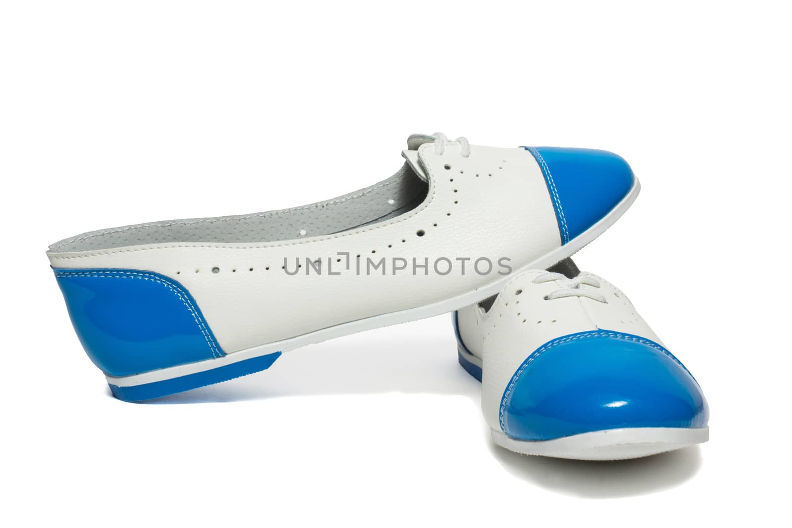 The photo shows the shoes on a white background