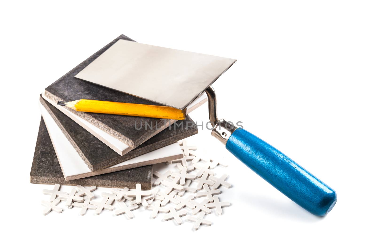 ceramic tiles and tools closeup on white background