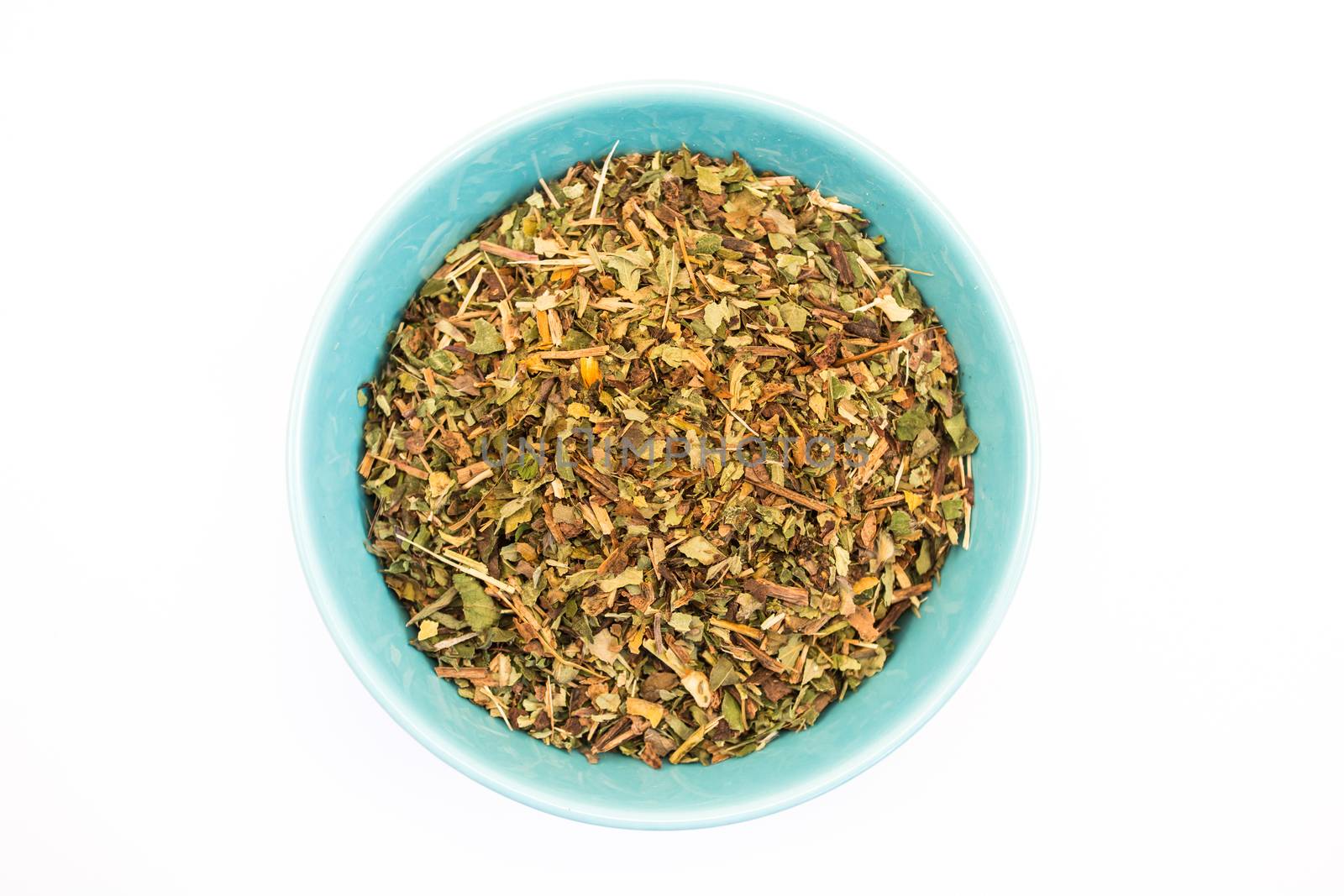 Tea herb in bowl on white background
