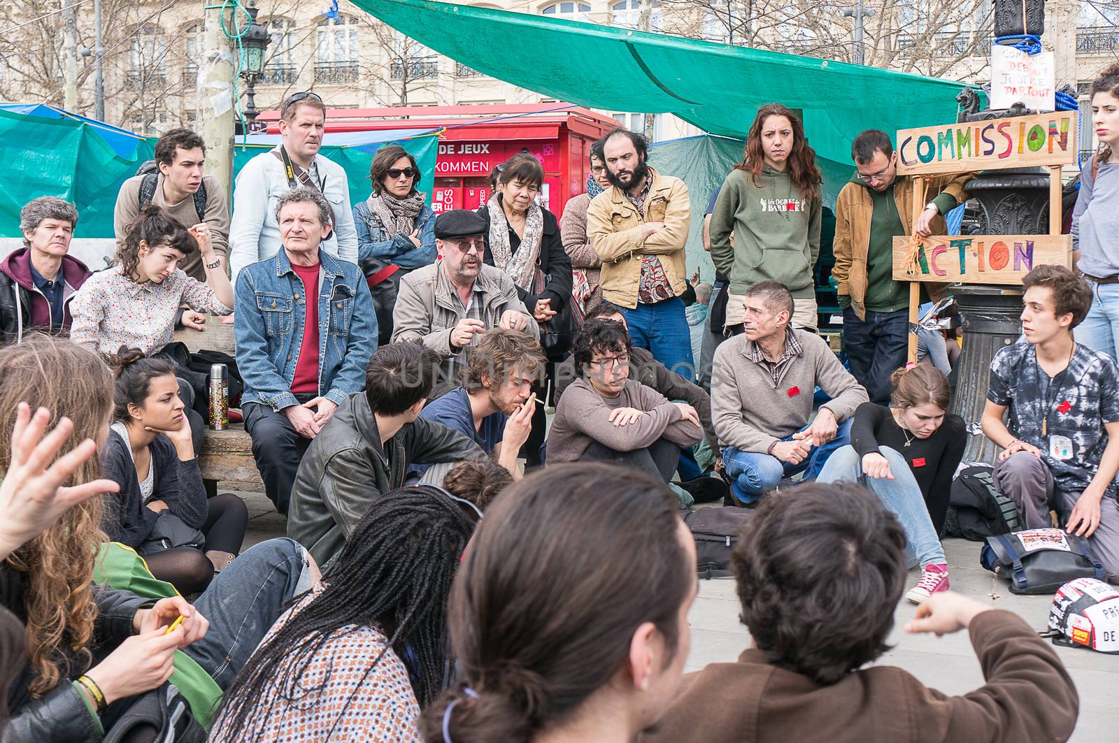 FRANCE, Paris: Hundreds of militants of the Nuit Debout or Standing night movement hold a general assembly to vote about the developments of the movement at the Place de la Republique in Paris on April 3, 2016. It has been four days that hundred of people have occupied the square to show, at first, their opposition to the labour reforms in the wake of the nationwide demonstration which took place on March 31, 2016. 