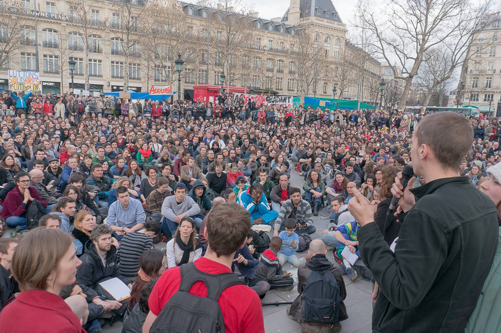 FRANCE, Paris: Hundreds of militants of the Nuit Debout or Standing night movement hold a general assembly to vote about the developments of the movement at the Place de la Republique in Paris on April 3, 2016. It has been four days that hundred of people have occupied the square to show, at first, their opposition to the labour reforms in the wake of the nationwide demonstration which took place on March 31, 2016. 