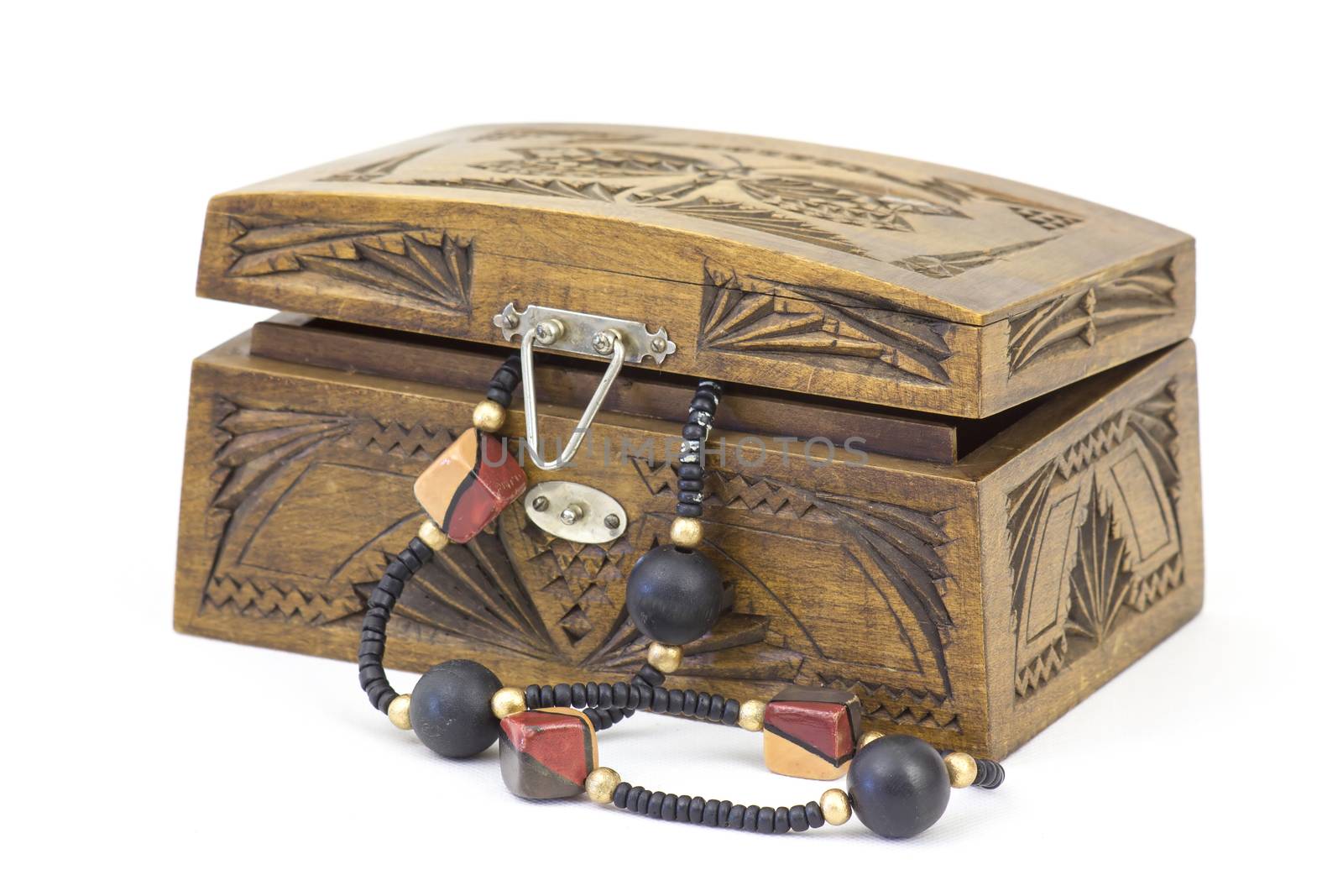 wooden casket with jewellery by miradrozdowski