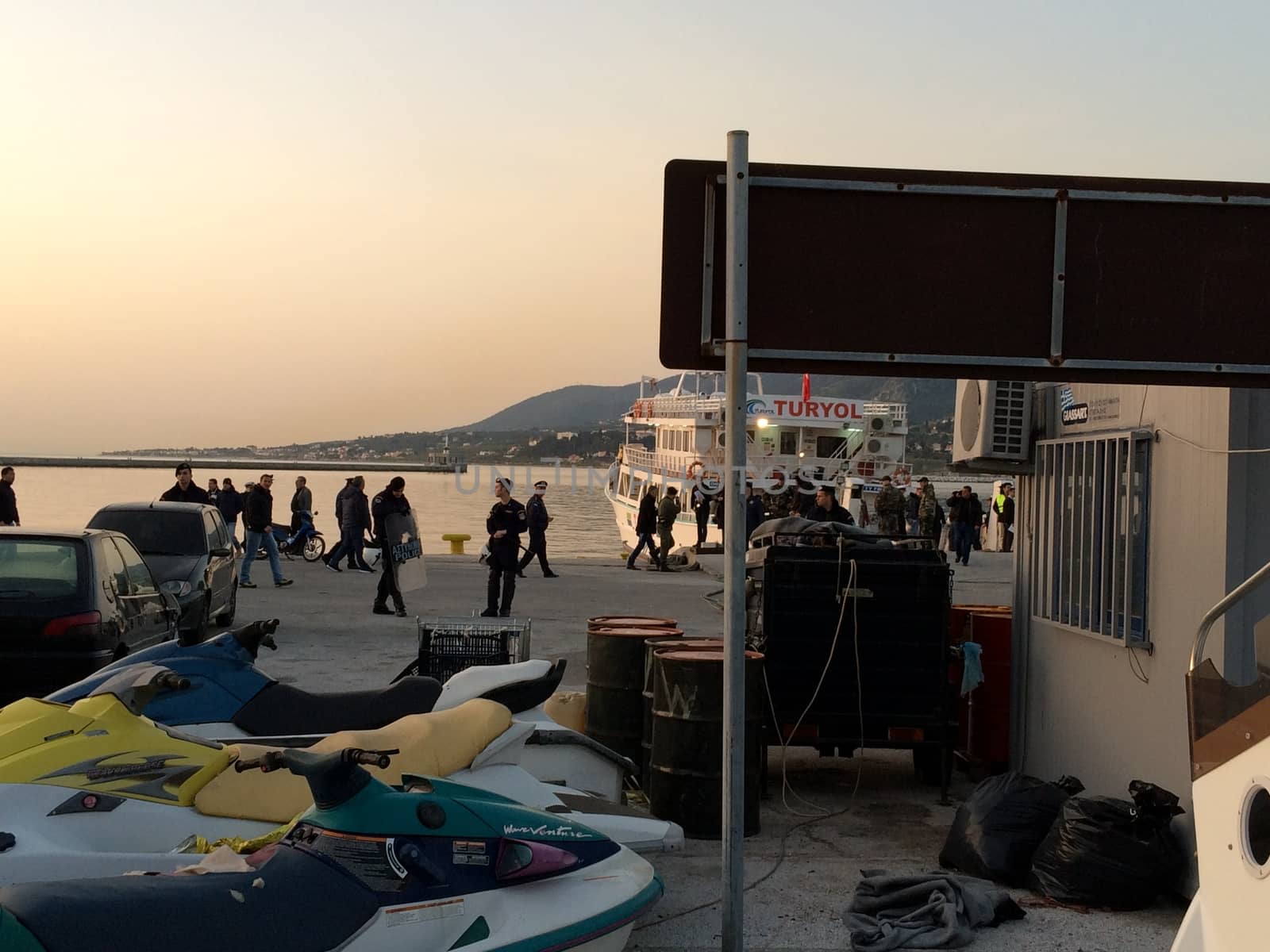 GREECE, Lesvos: A Turkish tourist boat lies in harbour in Lesbos, Greece on April 4, 2016 as the first migrants boarded the boat under police presence . The boat, which was chartered by the Greece government left for Dikili, Turkey shortly after. Greece sent a first wave of migrants back to Turkey on April 4 under an EU deal that has faced heavy criticism from rights groups. Under the agreement, designed to halt the main influx which comes from Turkey, all irregular migrants arriving since March 20 face being sent back, although the deal calls for each case to be examined individually. For every Syrian refugee returned, another Syrian refugee will be resettled from Turkey to the EU, with numbers capped at 72,000.