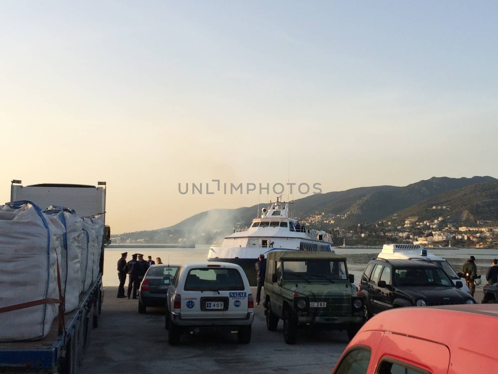 GREECE, Lesvos: A Turkish tourist boat with migrants in it leaves harbour in Lesbos, Greece on April 4, 2016 as Greece sent a first wave of migrants back to Turkey on April 4 under an EU deal that has faced heavy criticism from rights groups. Under the agreement, designed to halt the main influx which comes from Turkey, all irregular migrants arriving since March 20 face being sent back, although the deal calls for each case to be examined individually. For every Syrian refugee returned, another Syrian refugee will be resettled from Turkey to the EU, with numbers capped at 72,000.