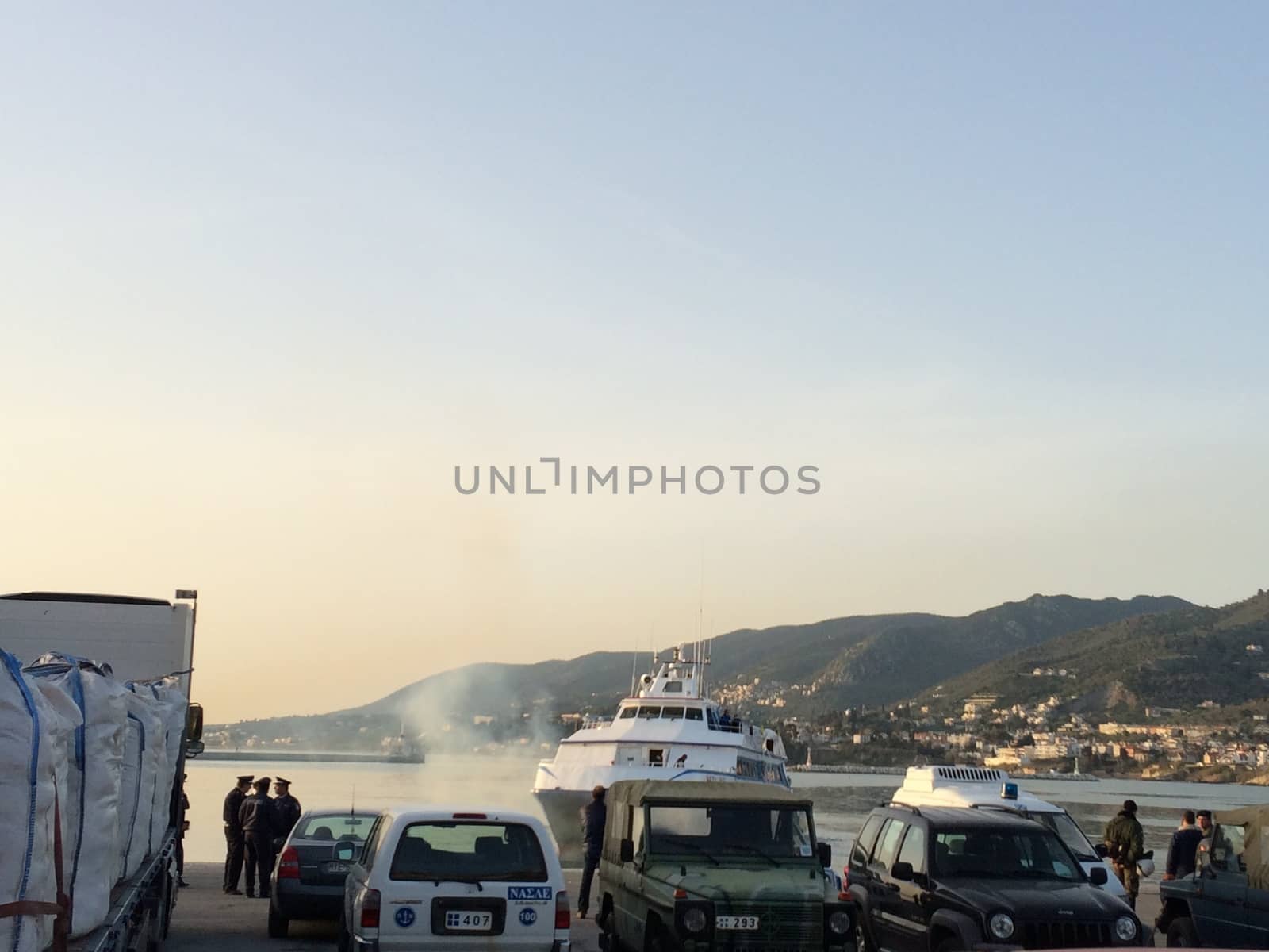 GREECE, Lesvos: A Turkish tourist boat with migrants in it leaves harbour in Lesbos, Greece on April 4, 2016 as Greece sent a first wave of migrants back to Turkey on April 4 under an EU deal that has faced heavy criticism from rights groups. Under the agreement, designed to halt the main influx which comes from Turkey, all irregular migrants arriving since March 20 face being sent back, although the deal calls for each case to be examined individually. For every Syrian refugee returned, another Syrian refugee will be resettled from Turkey to the EU, with numbers capped at 72,000.