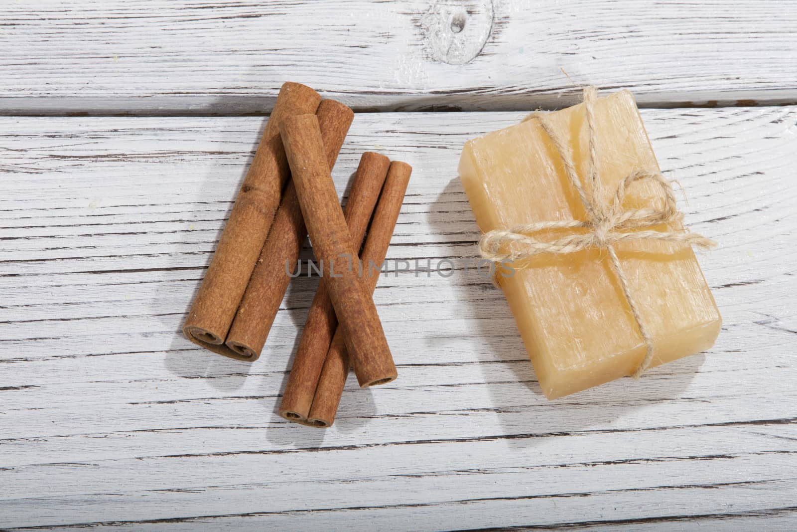 handmade soap with cinnamon on wooden background by senkaya