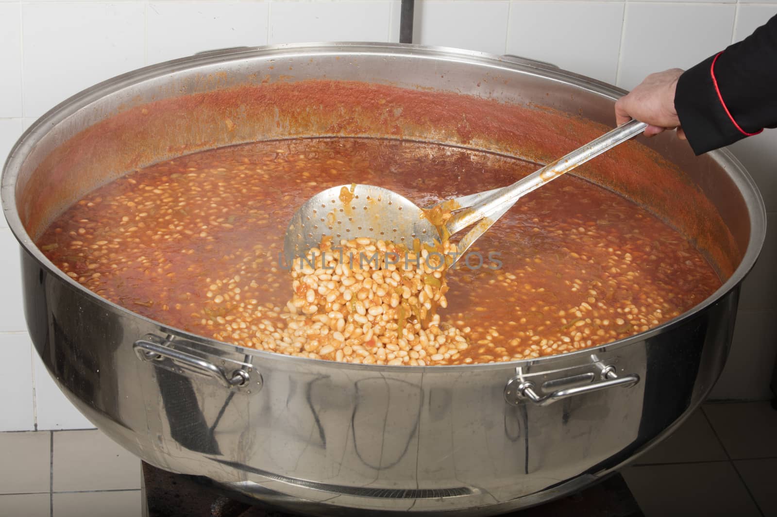 chef cooking beans at commercial kitchen-bean