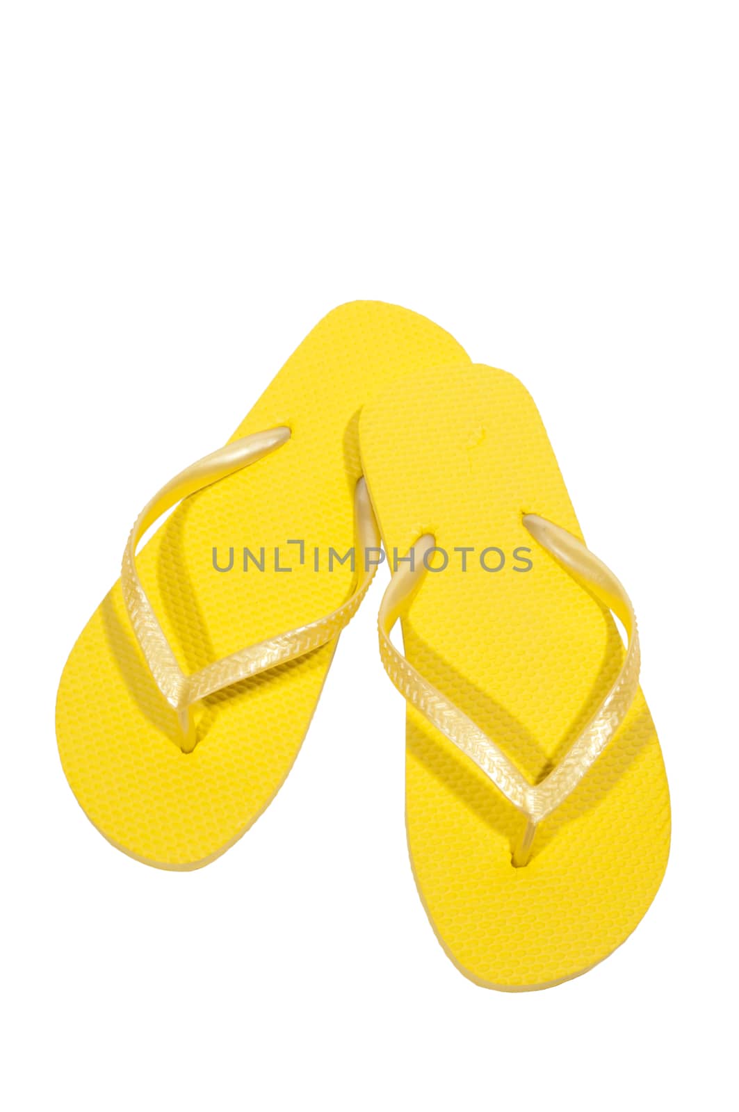 Vertical shot of yellow flip flops or thongs.  Isolated on white.