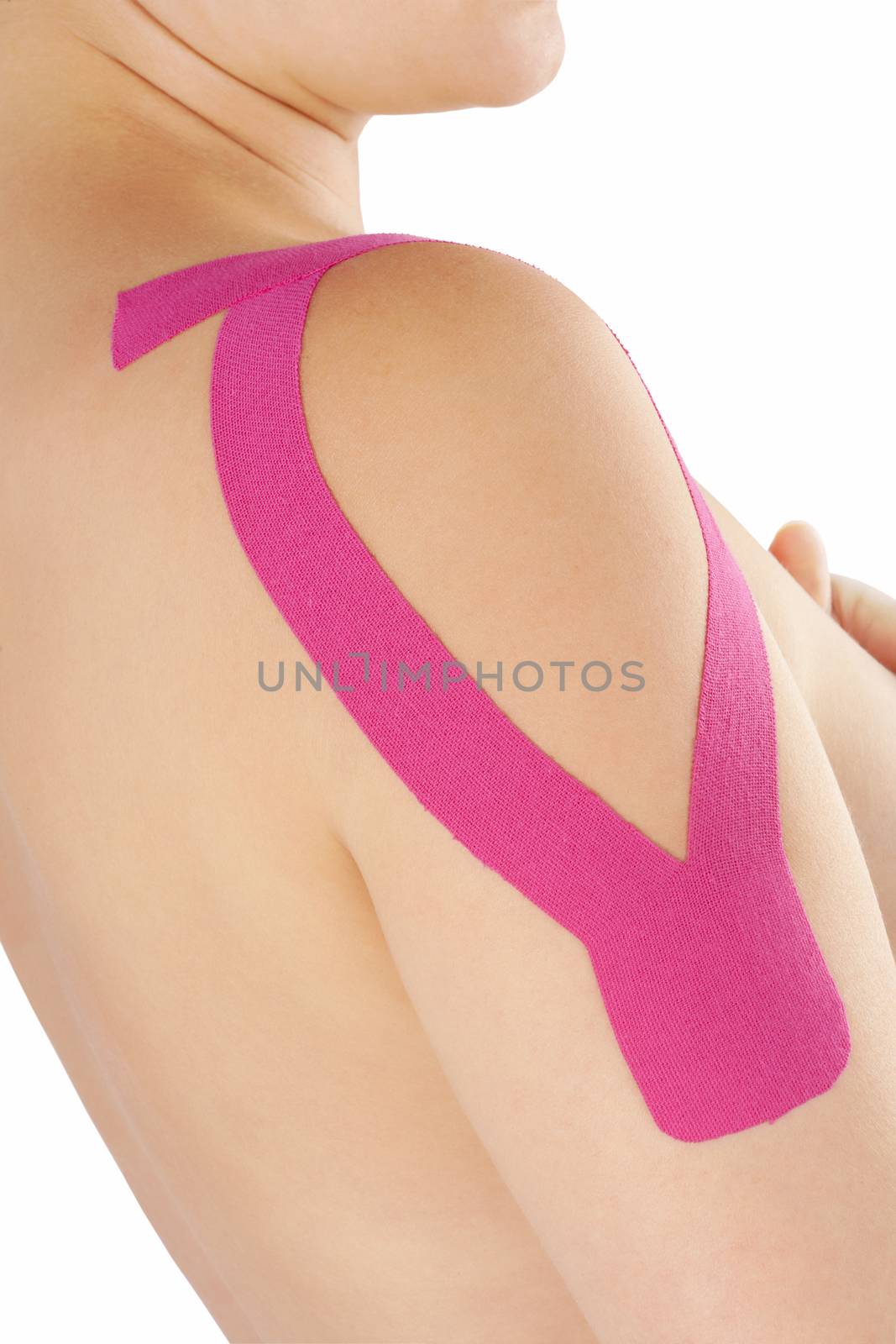 Therapeutic tape on female shoulder. by eskymaks