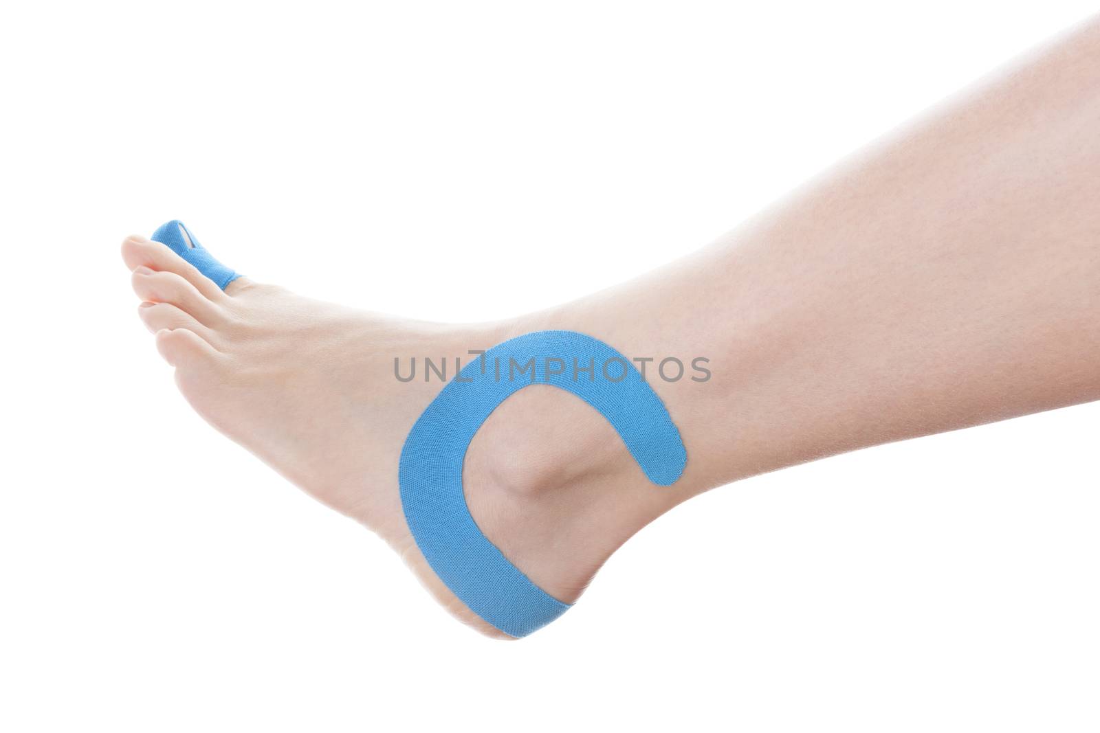 Therapeutic tape on female ankle isolated on white background. Chronic pain, alternative medicine. Rehabilitation and physiotherapy.