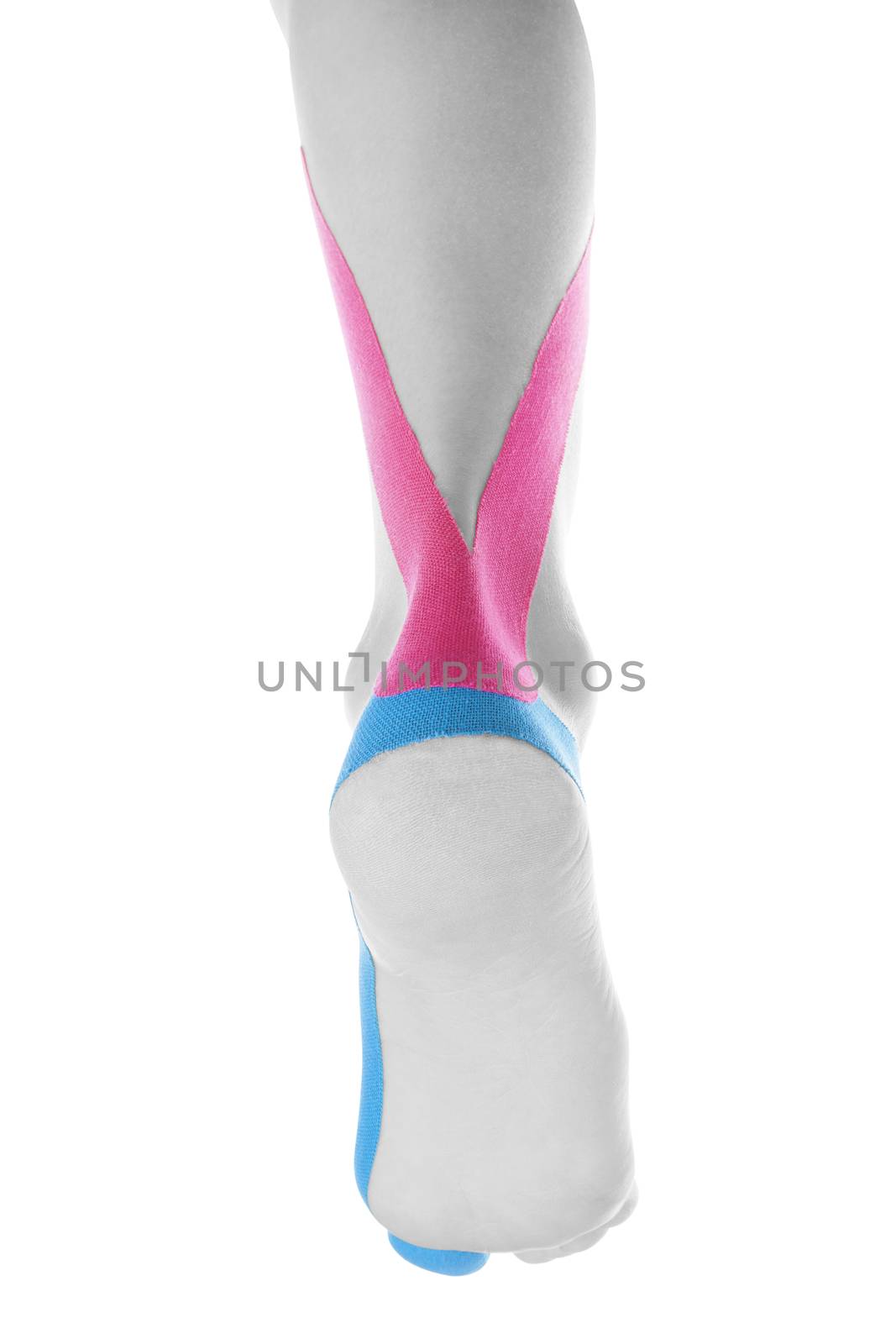 Therapeutic tape on female heel isolated on white background. Chronic pain, alternative medicine. Rehabilitation and physiotherapy.