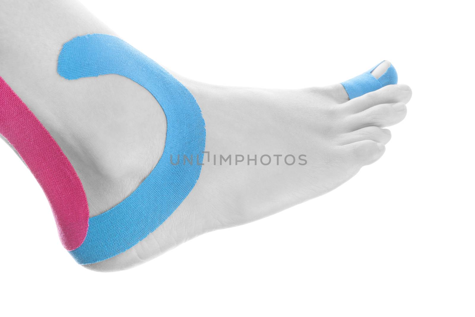 Therapeutic tape on female ankle isolated on white background. Chronic pain, alternative medicine. Rehabilitation and physiotherapy.