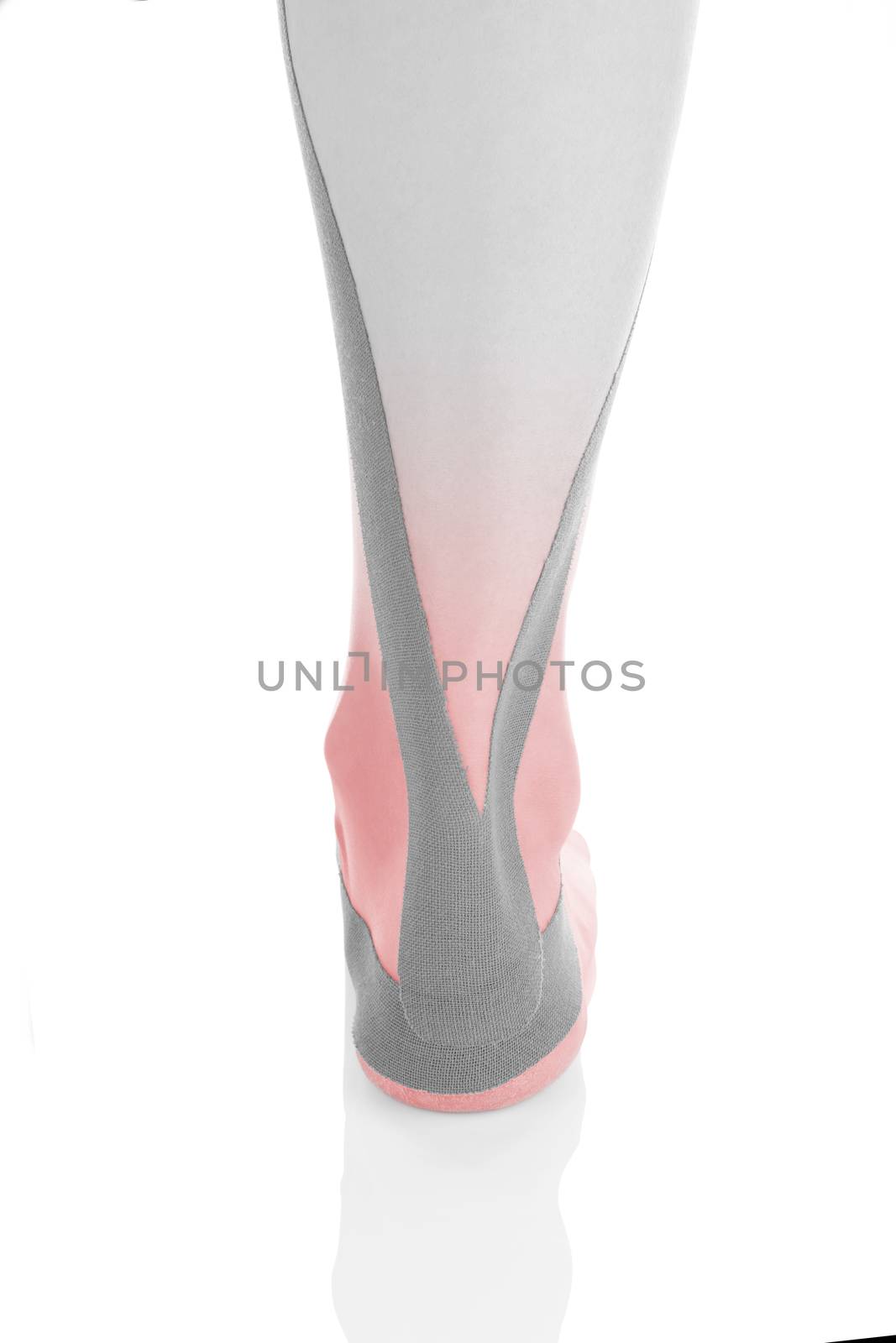Therapeutic tape on female heel and calf isolated on white background. Chronic pain, alternative medicine. Rehabilitation and physiotherapy. Calf pain.