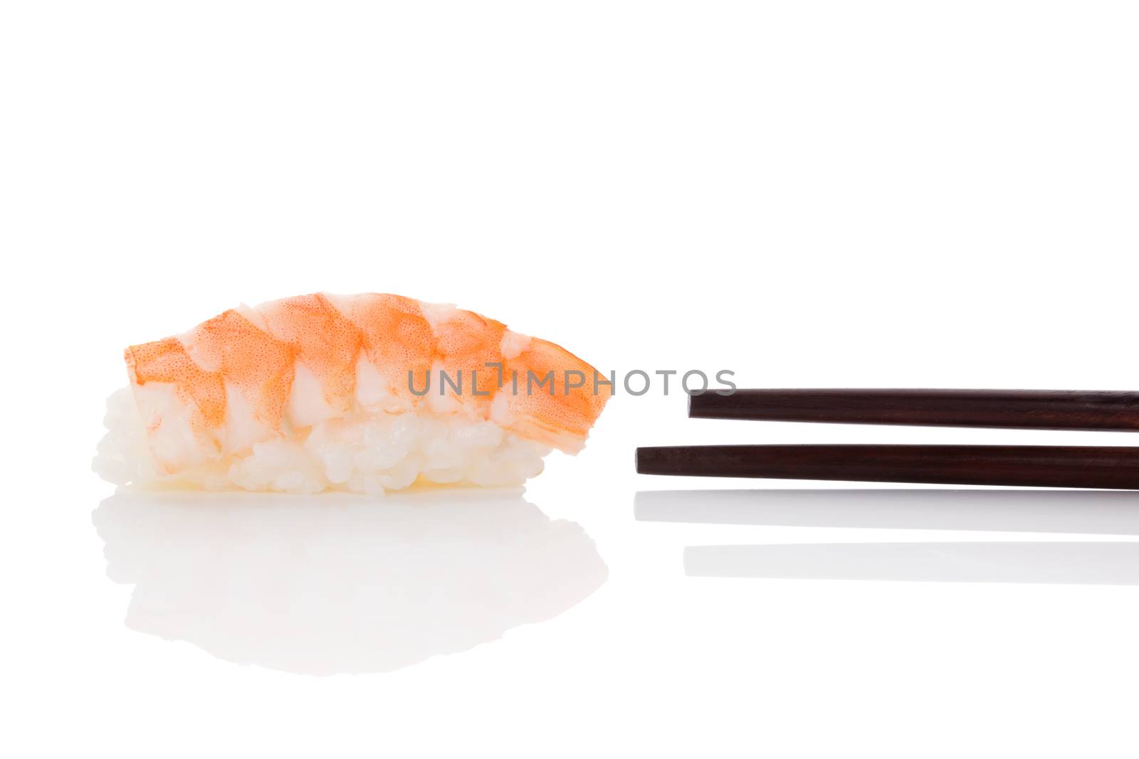 Delicious luxurious nigiri sushi with shrimp and chopsticks isolated on white background. Minimal contemporary asian style.