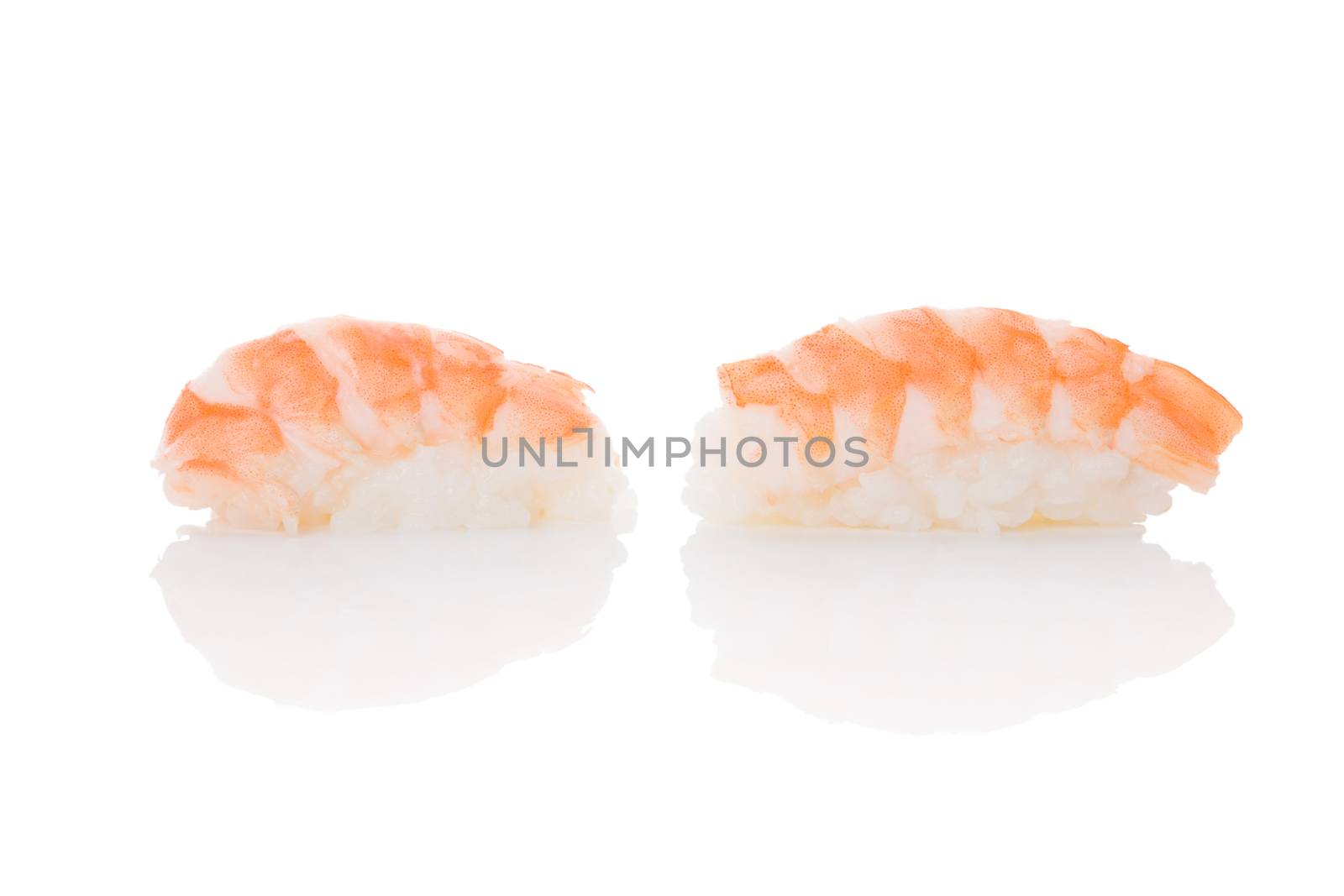 Delicious luxurious nigiri sushi with shrimp isolated on white background. Minimal contemporary asian style.